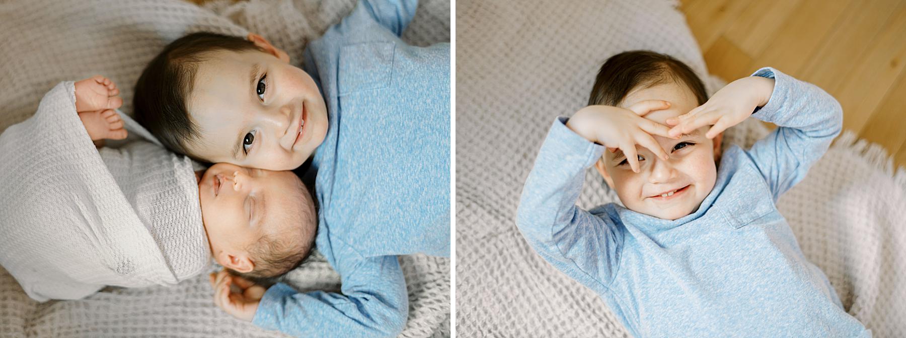 Big brother interacting with his new baby brother in a natural way