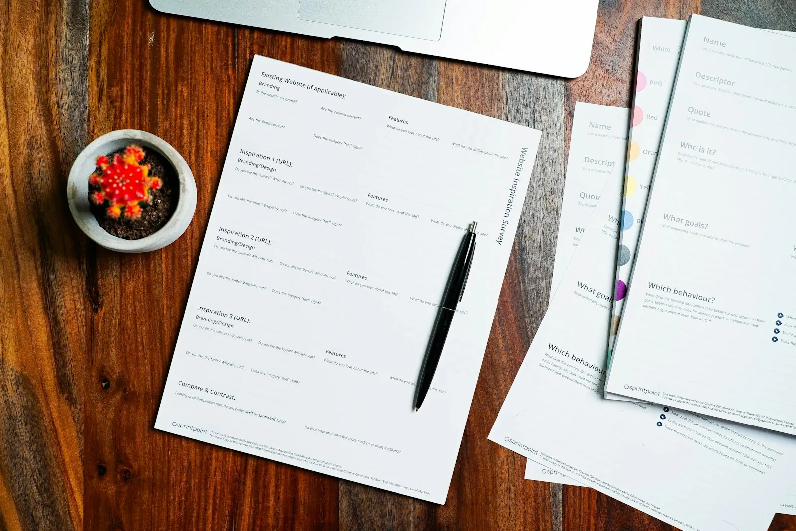 Insurance paperwork and a pen on a wooden table