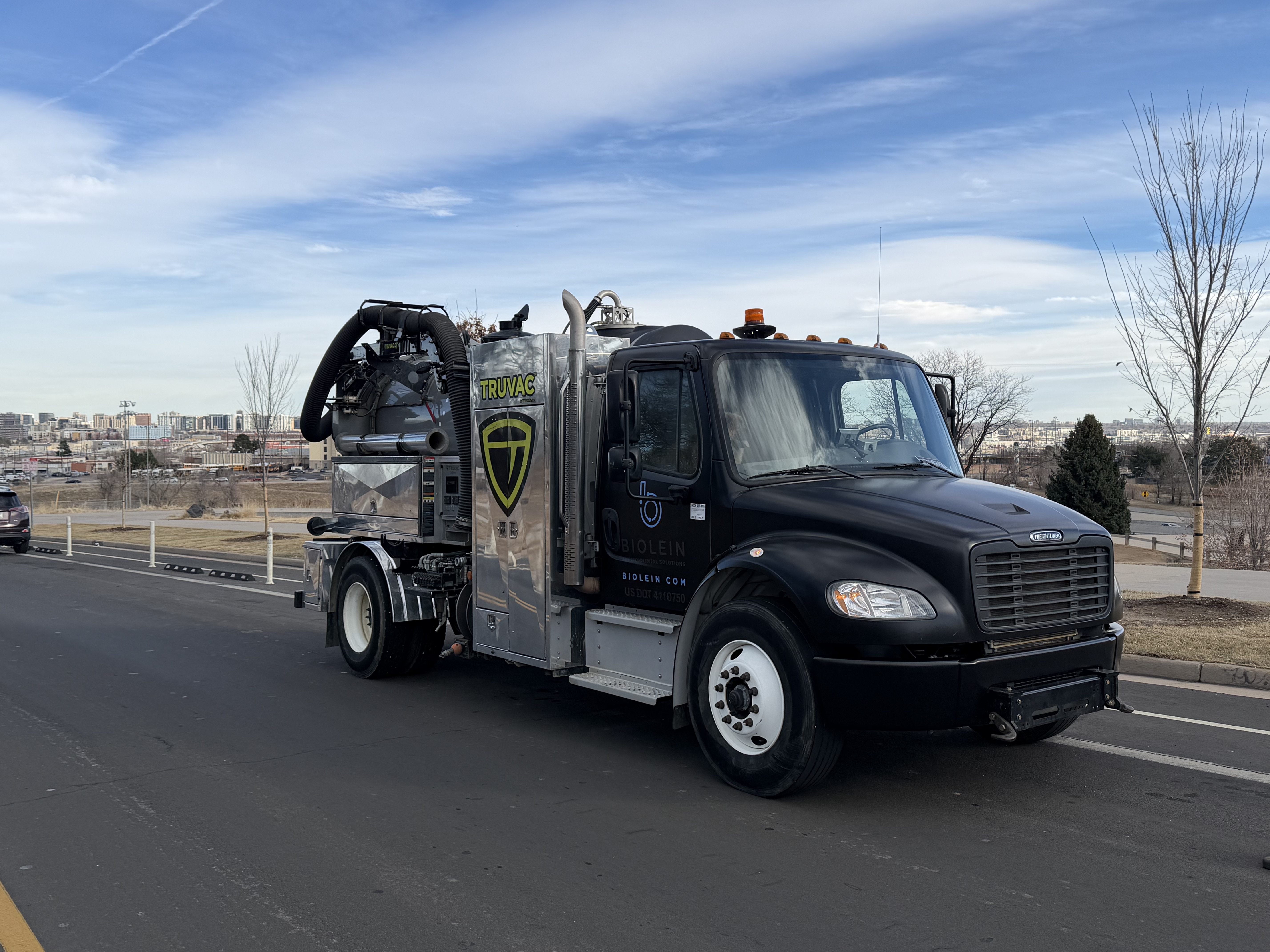 Hydrovac vacuum truck for storm drain cleaning and environmental services on city street