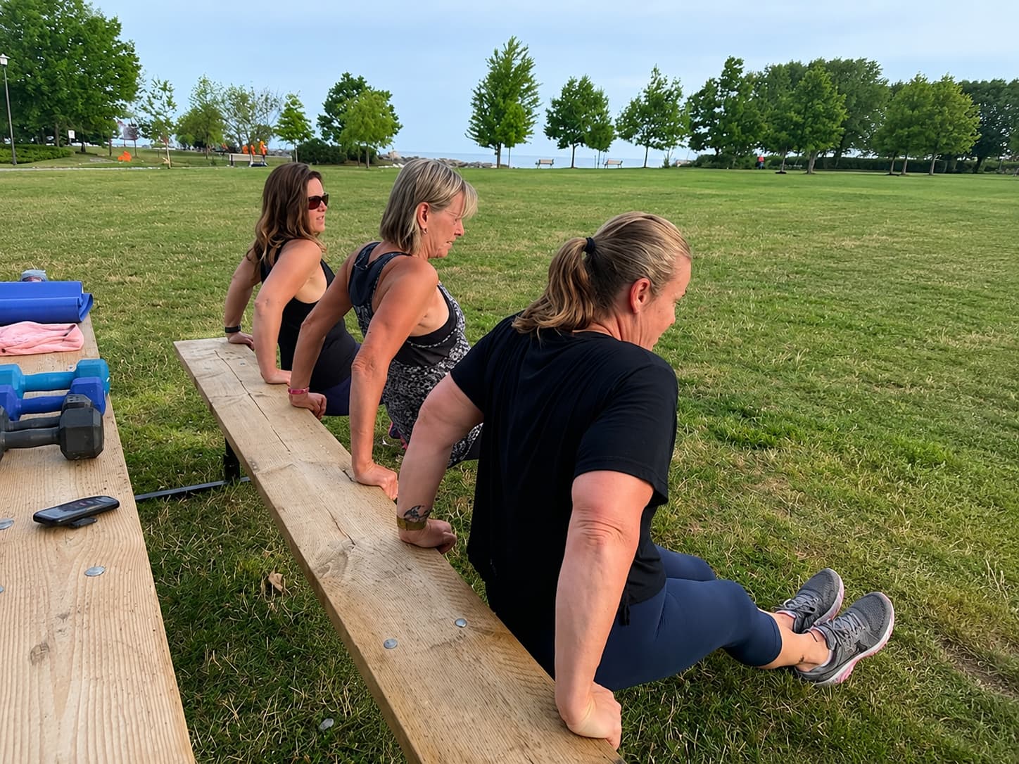 Women training at SHi LiFTS outdoor session by the water