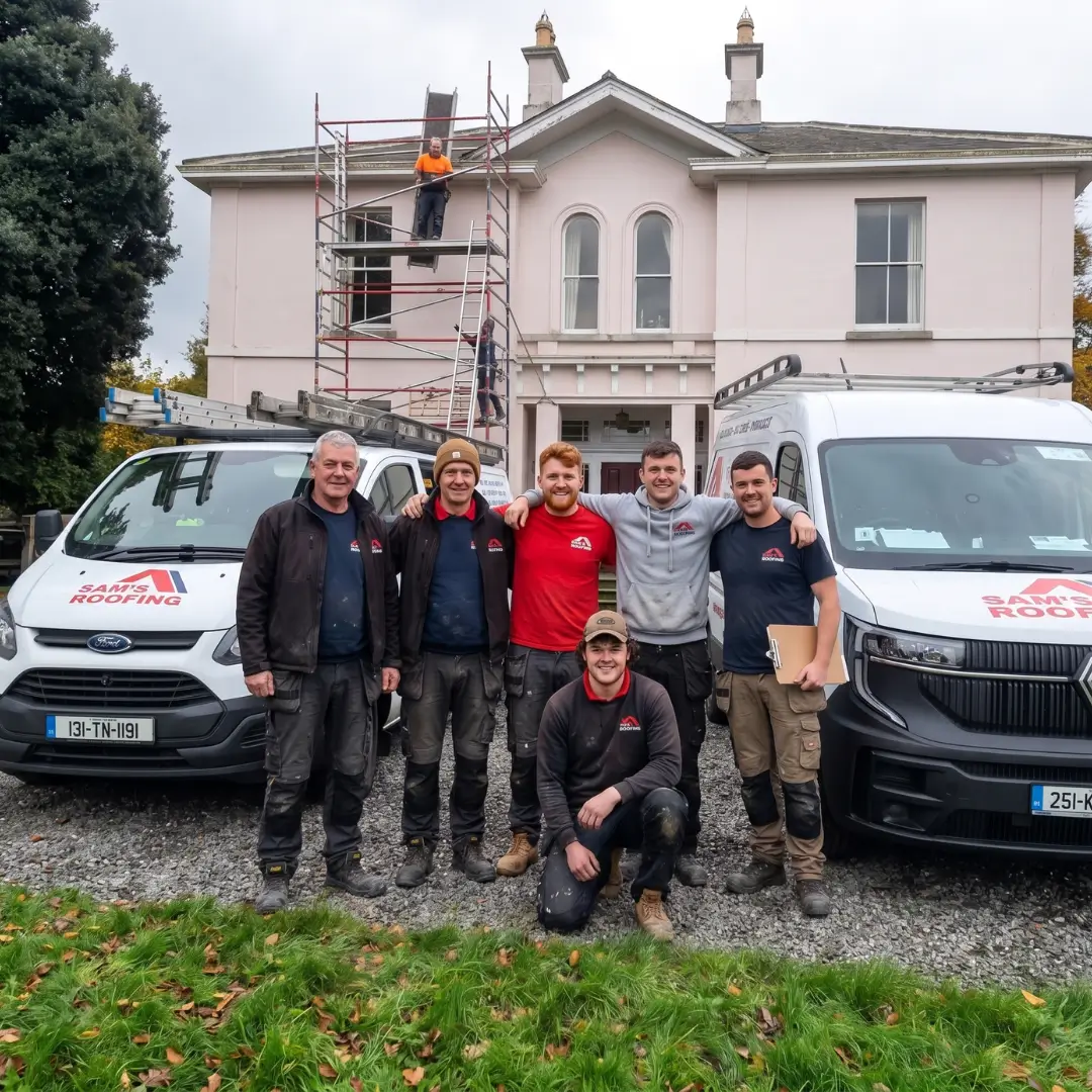 The Sam's Roofing crew on a job site with branded vans