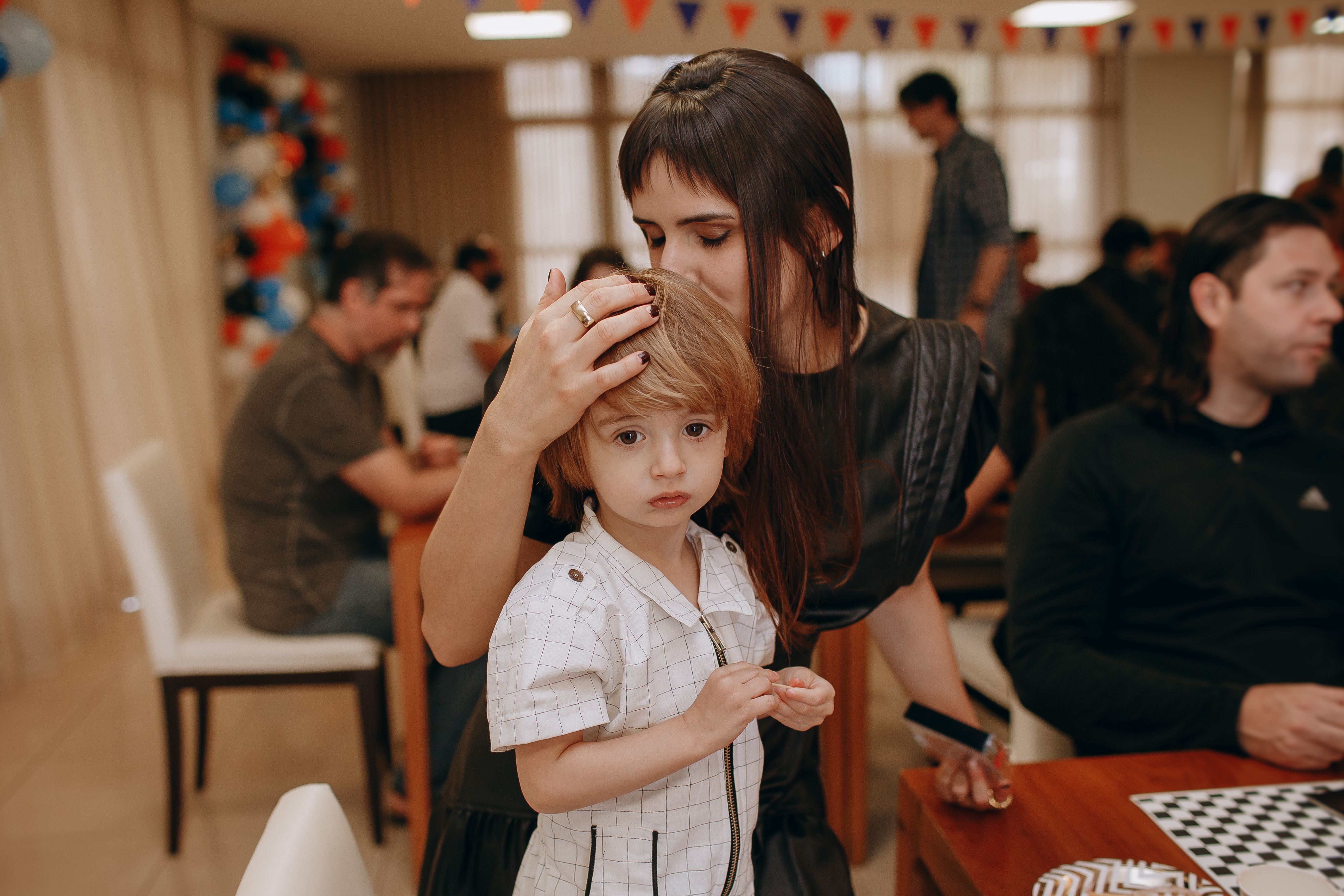 Mother and young child at a community gathering