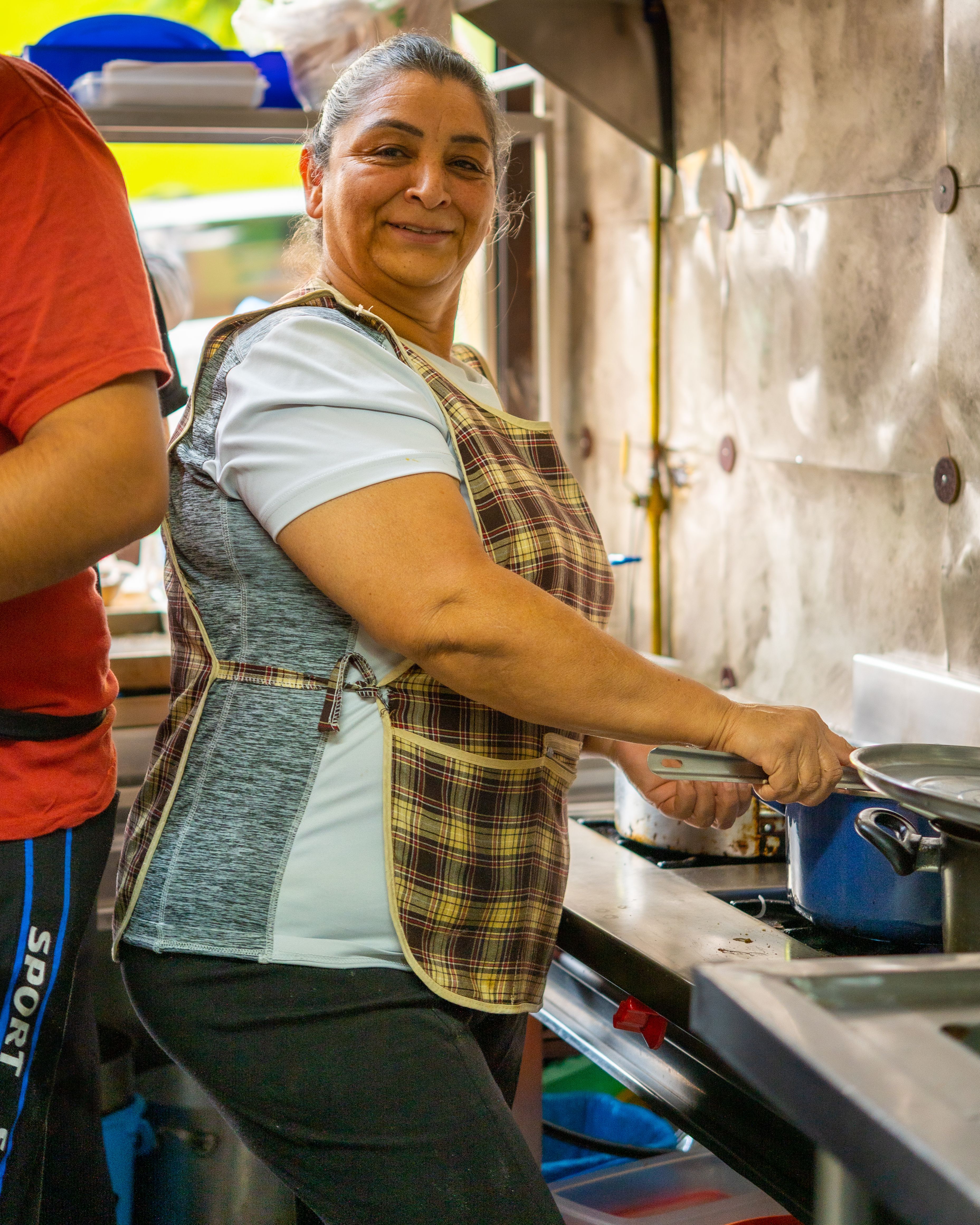 Woman preparing food in a professional kitchen