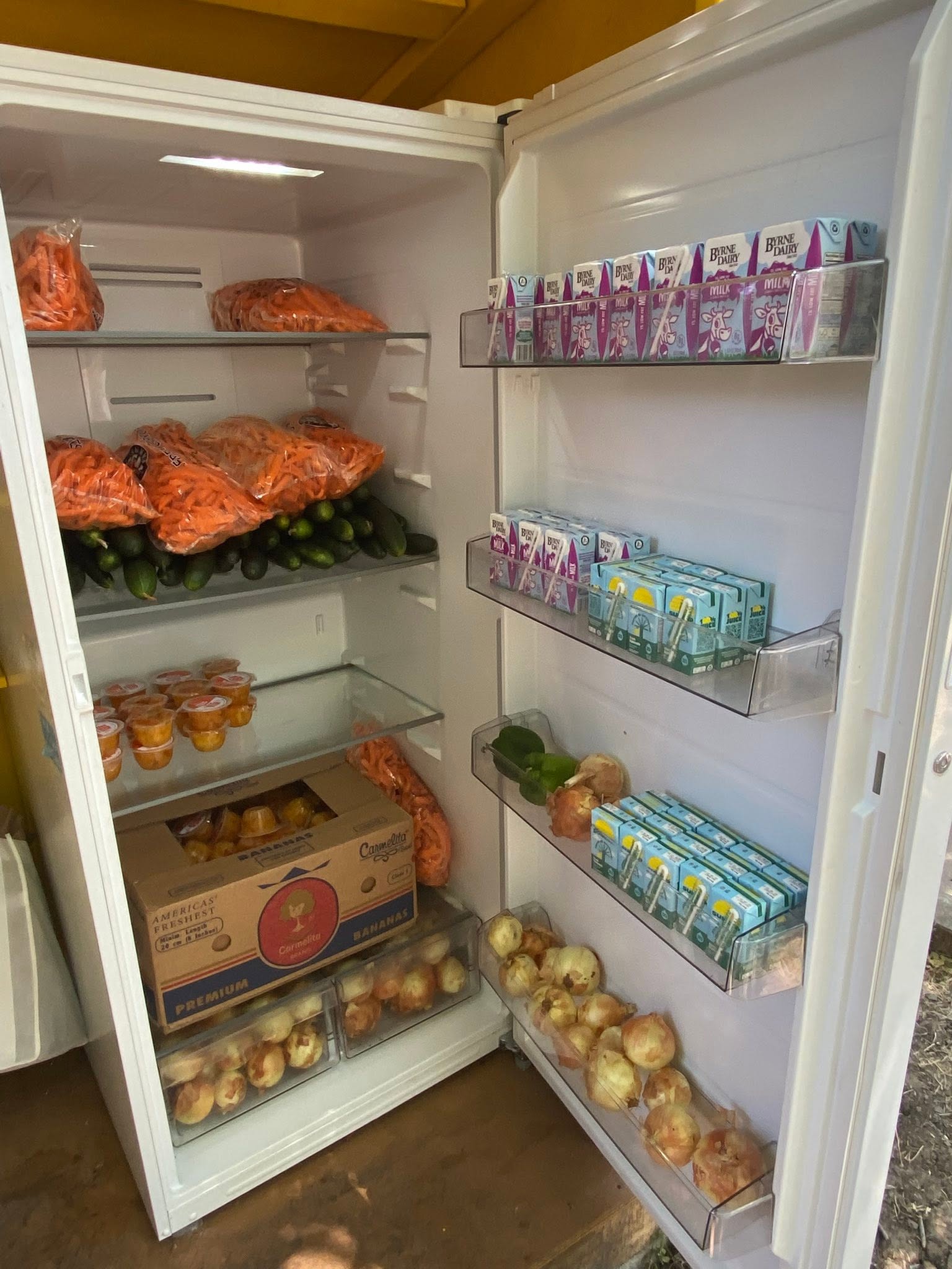 Central Texas neighborhood community pantry stocked with food