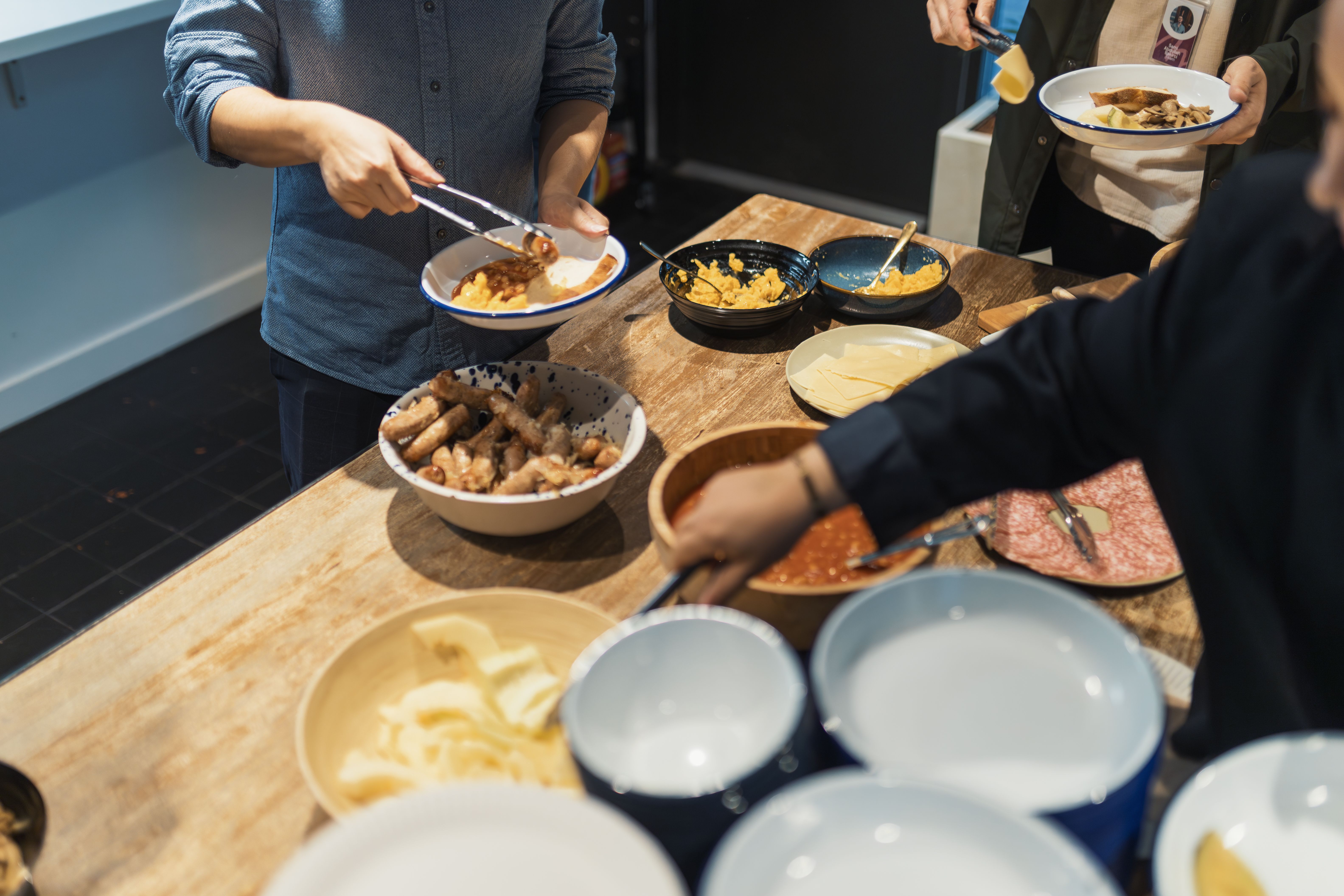 People preparing and sharing food together
