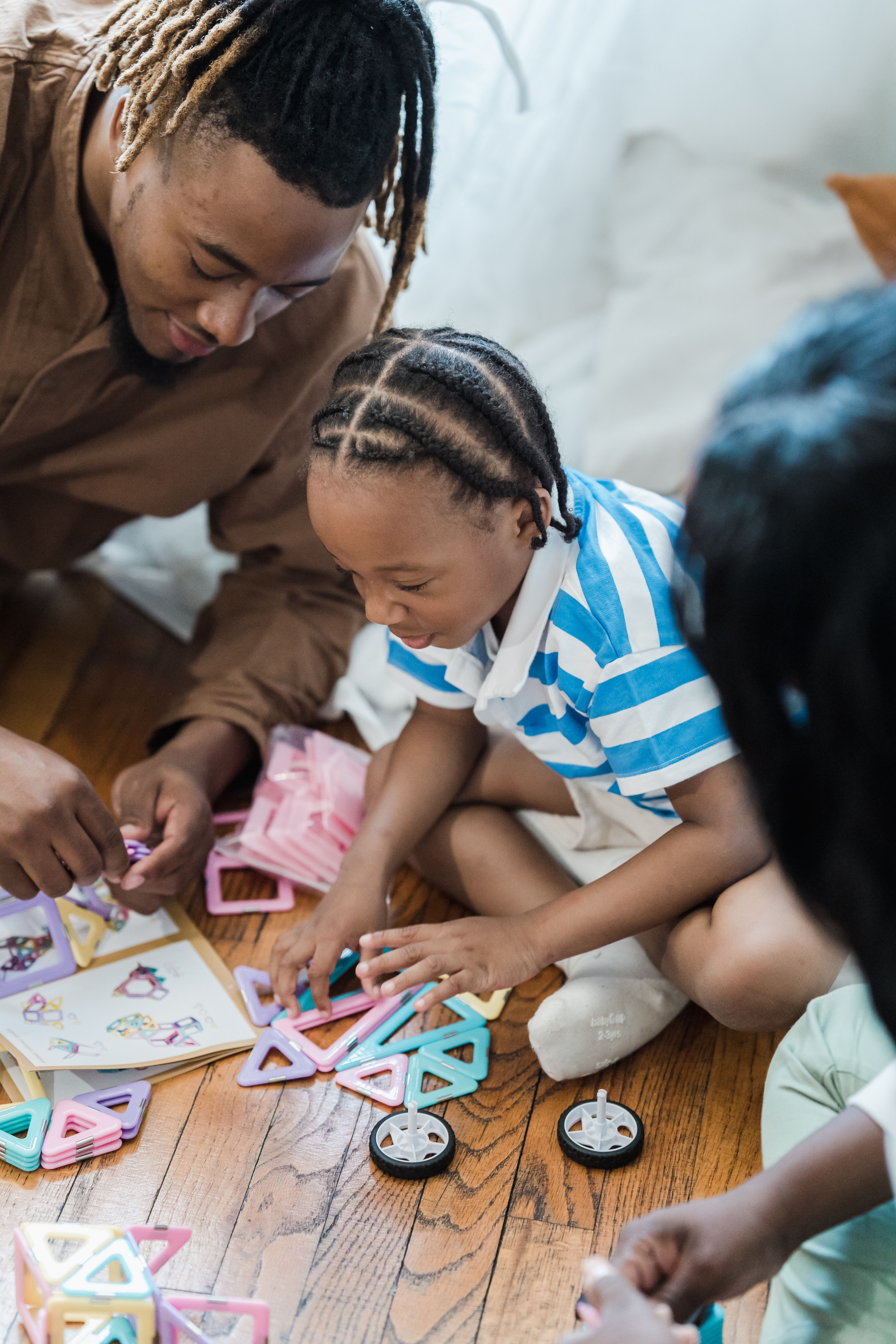 Adult and children building something together