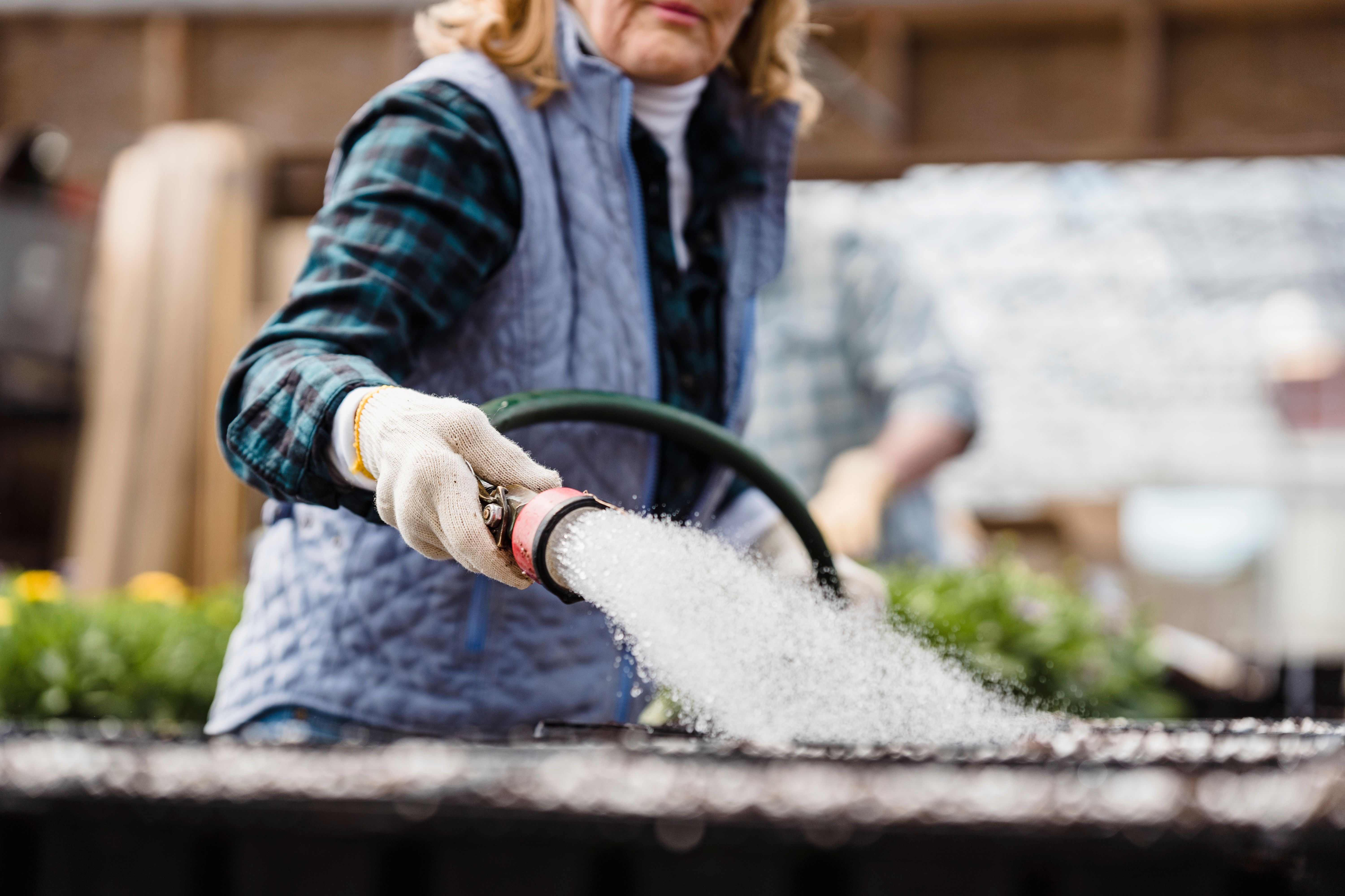 Woman watering a garden