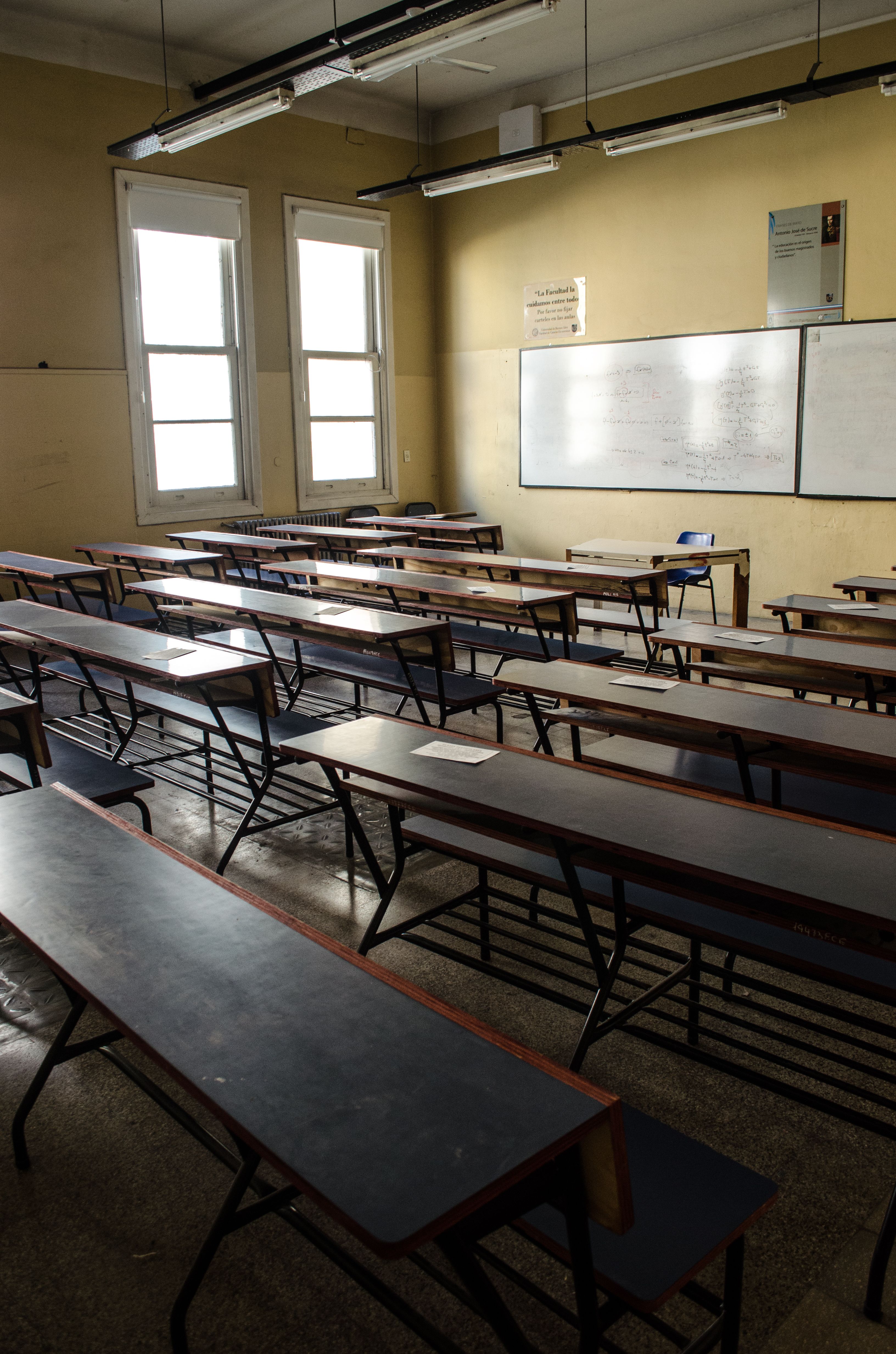Empty classroom with rows of desks