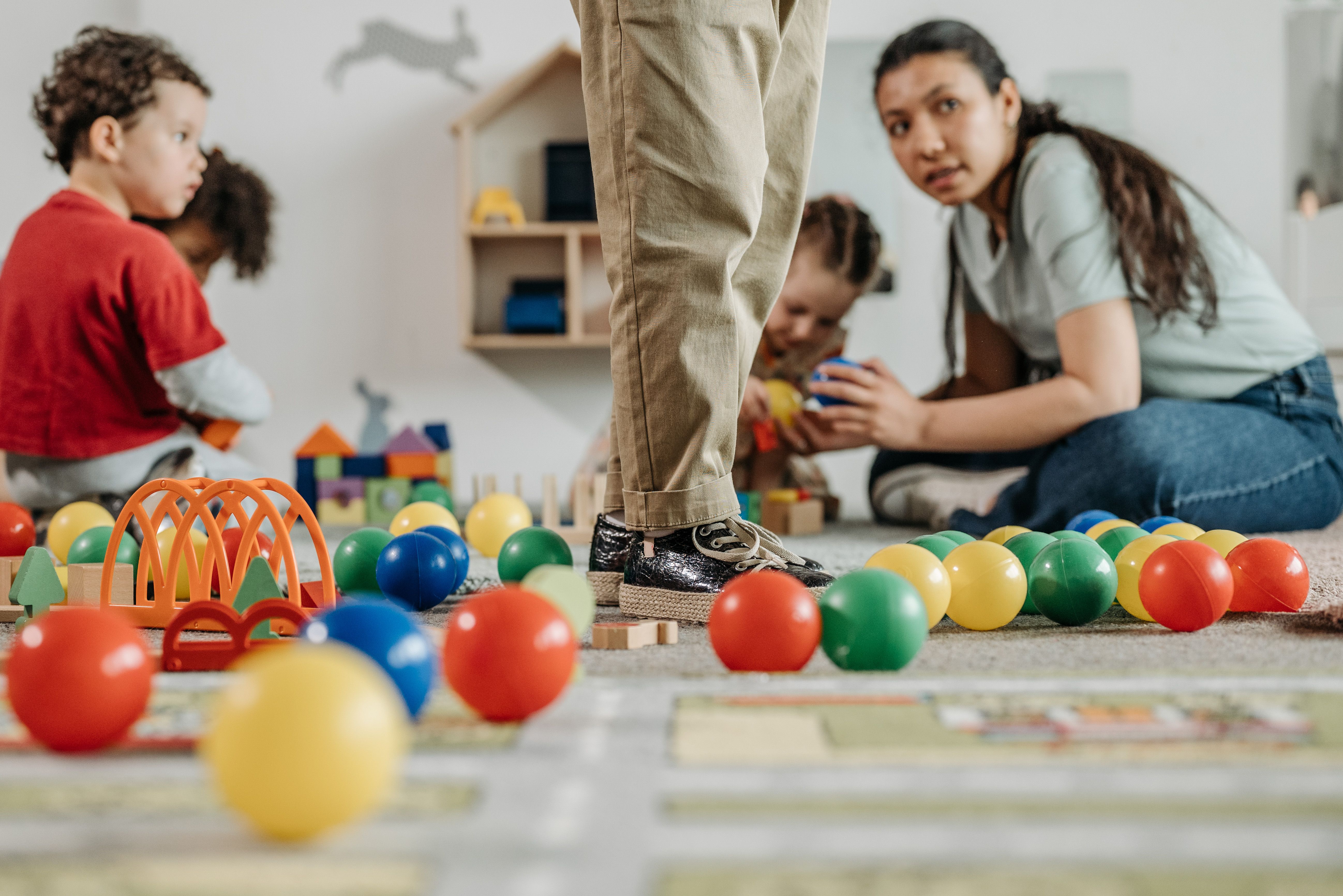 Children and caregivers in a childcare setting