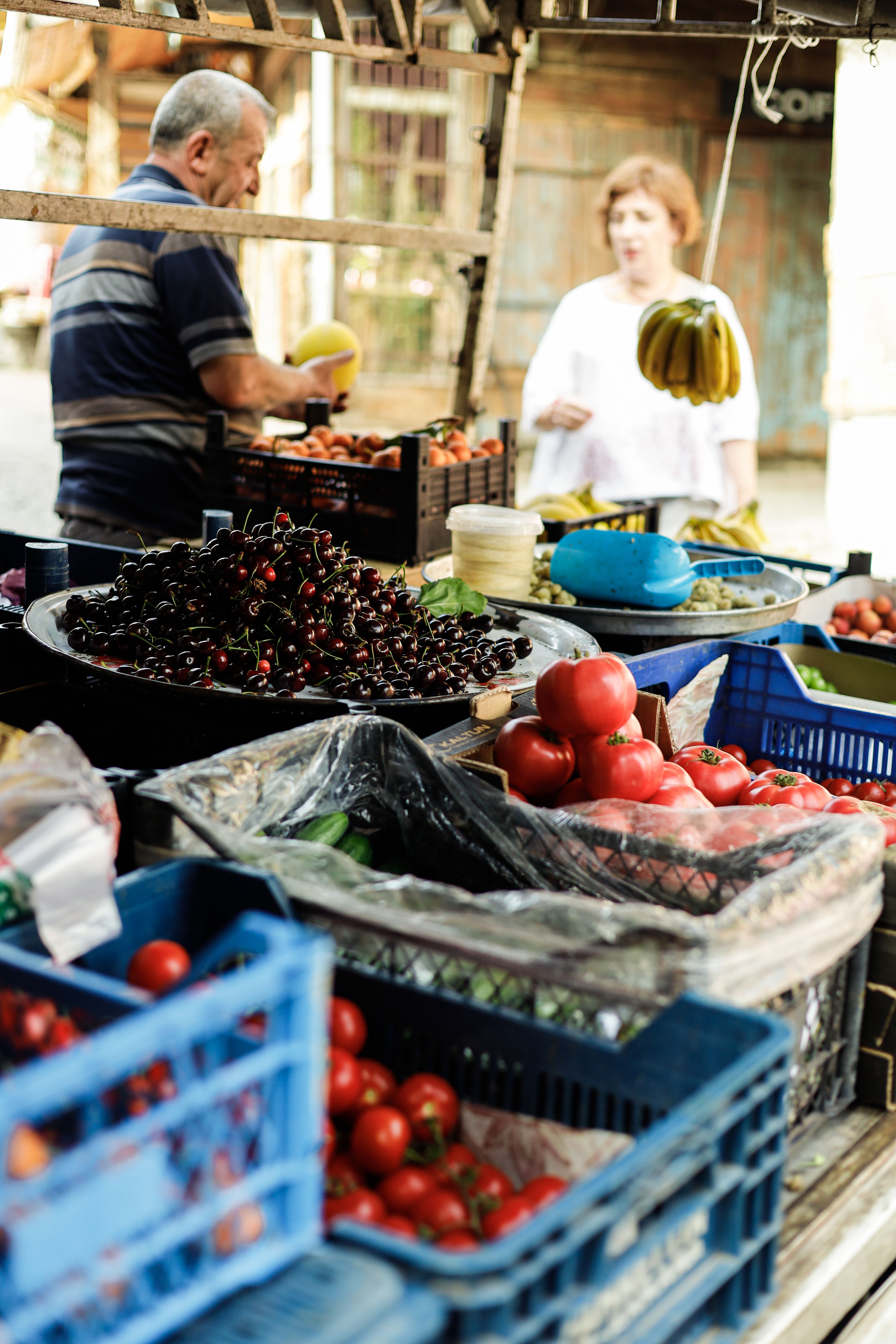 Produce market with customers and vendors
