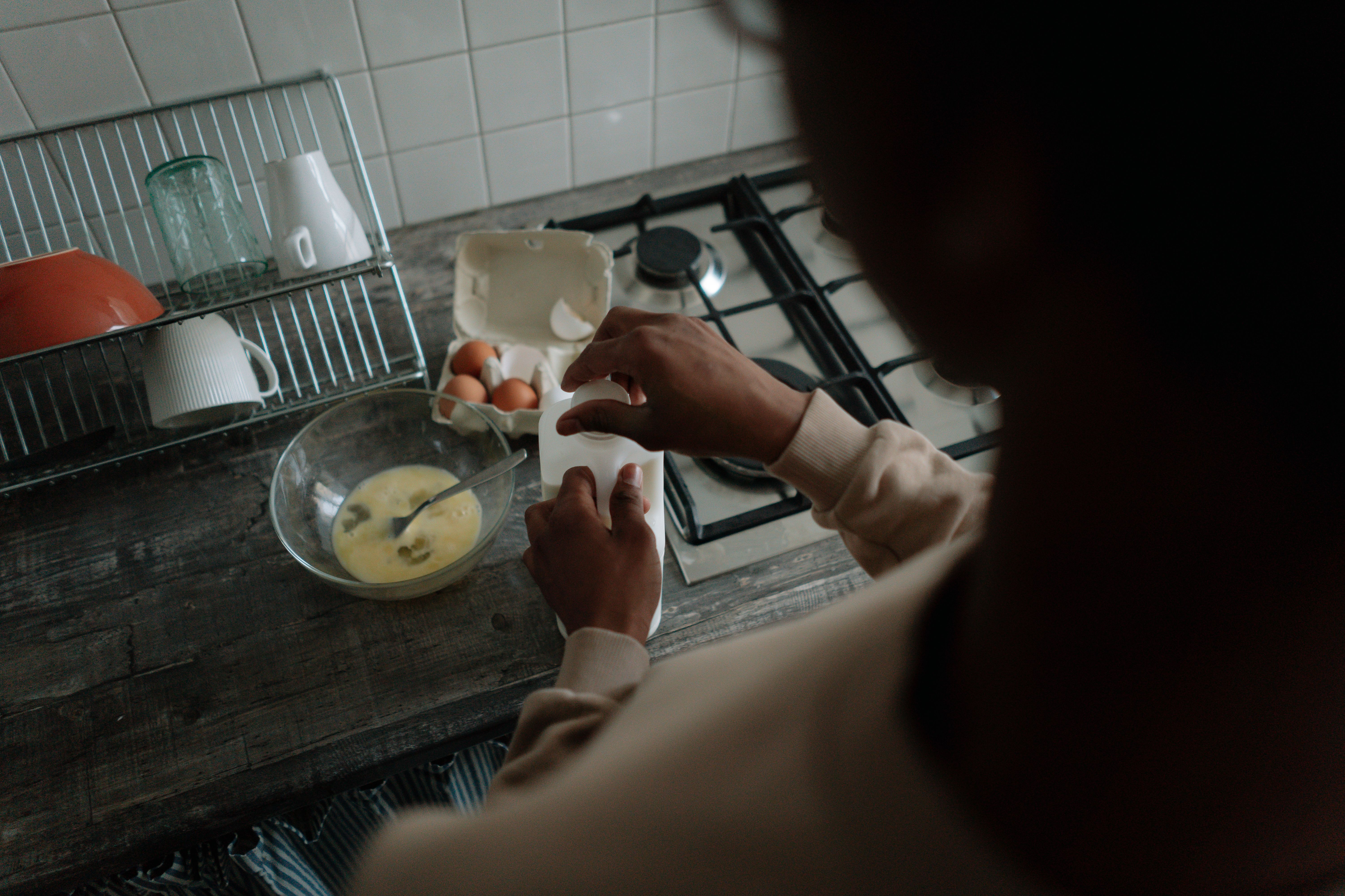 Person preparing food in a home kitchen