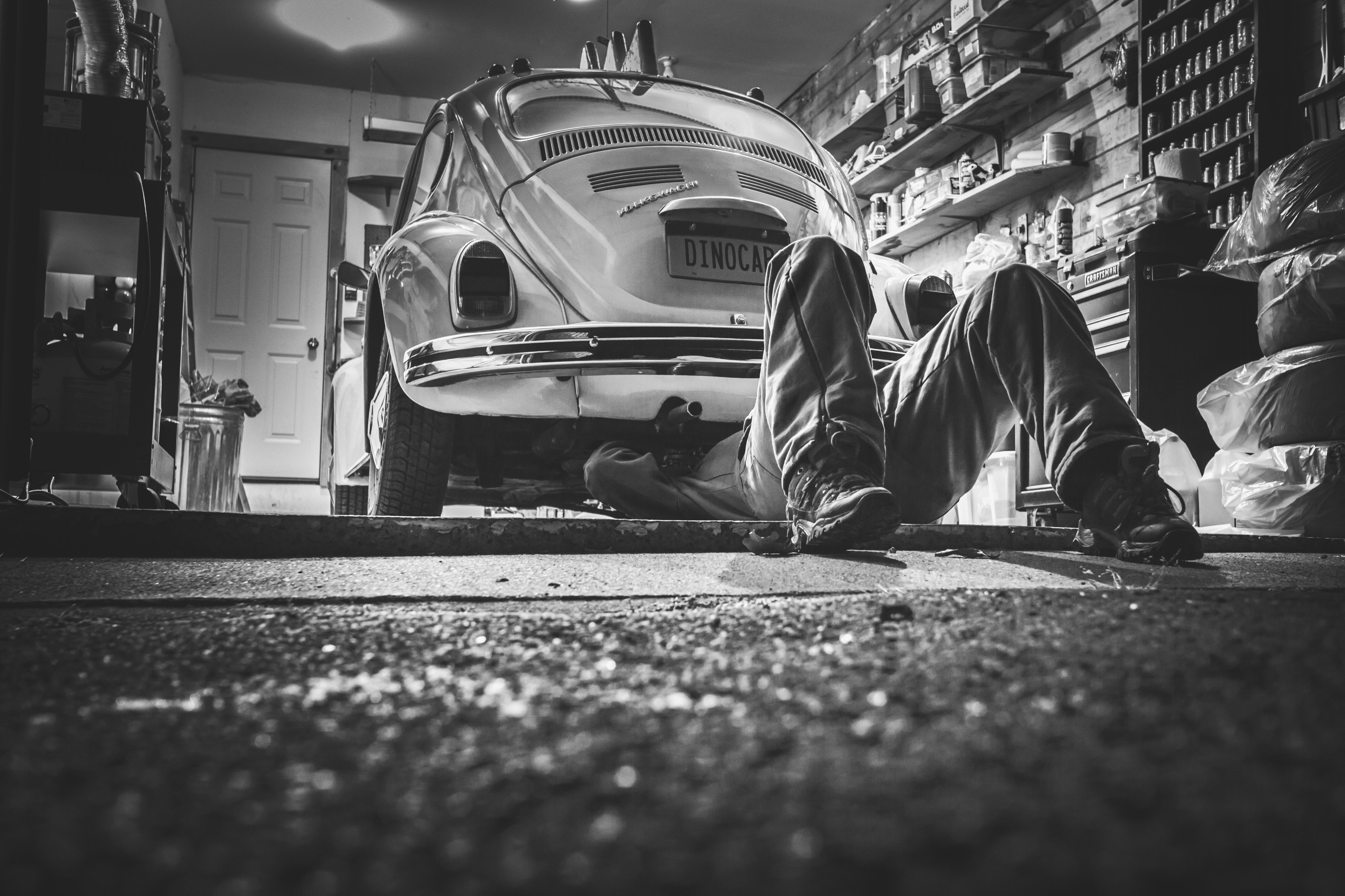 Mechanic repairing a car in a garage