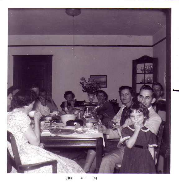 Historic family gathering around a table