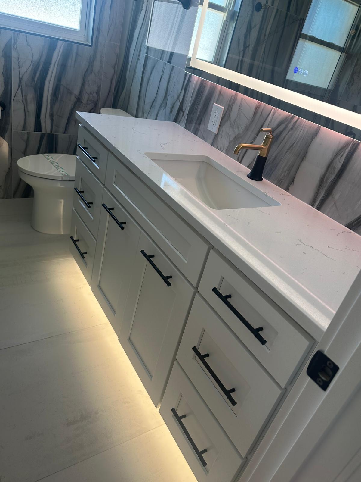 Marble vanity bathroom with LED lighting