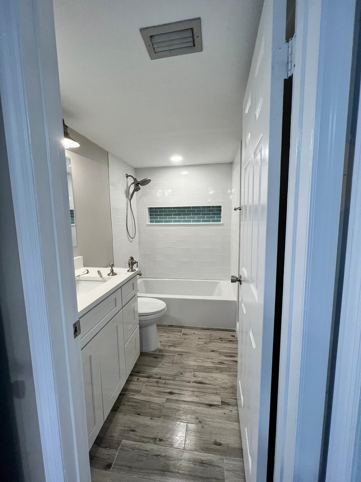 Bathroom renovation with wood look tile