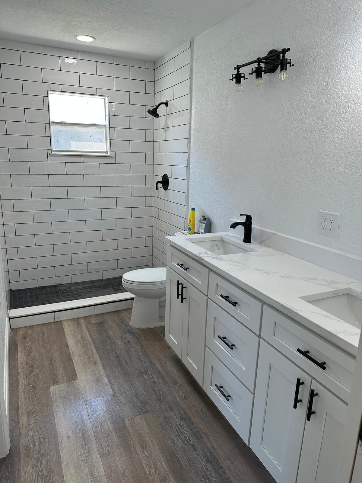 Full bathroom remodel with subway tile shower