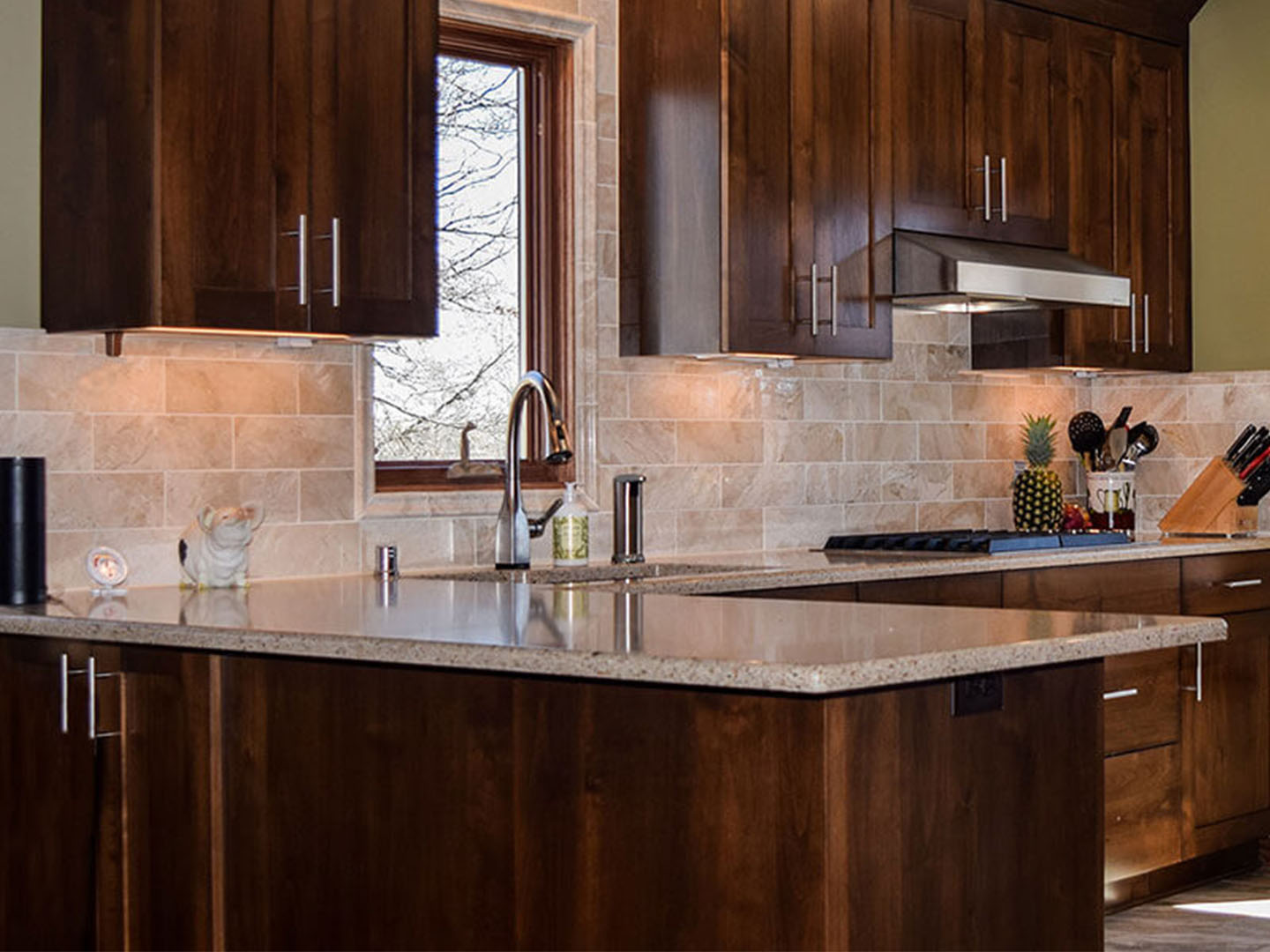 Dark wood cabinets with light tile