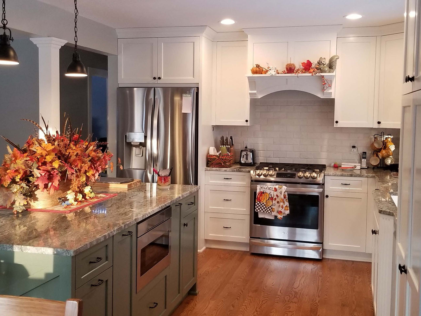 White cabinets with granite island