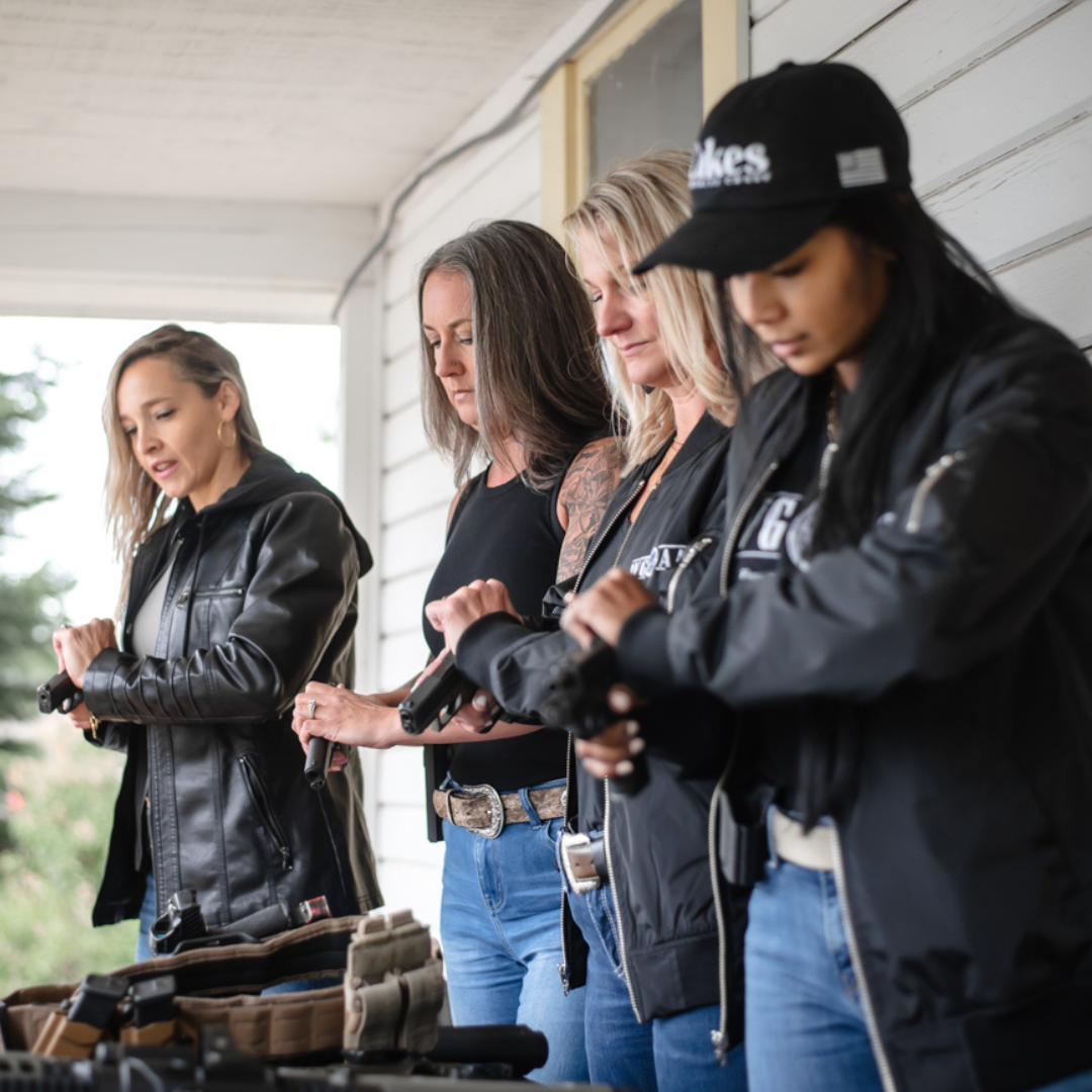 Women racking slides together at training