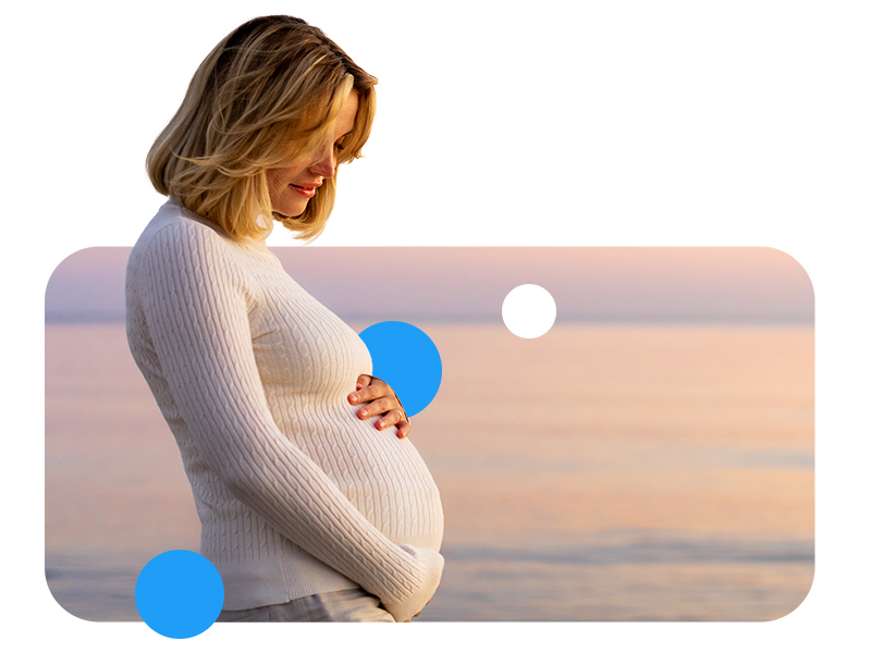 Pregnant Woman at Beach in the Evening