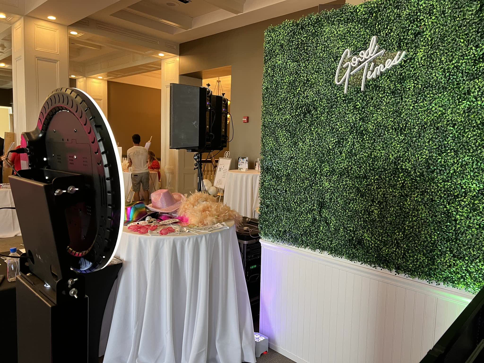 Greenery wall backdrop with neon sign