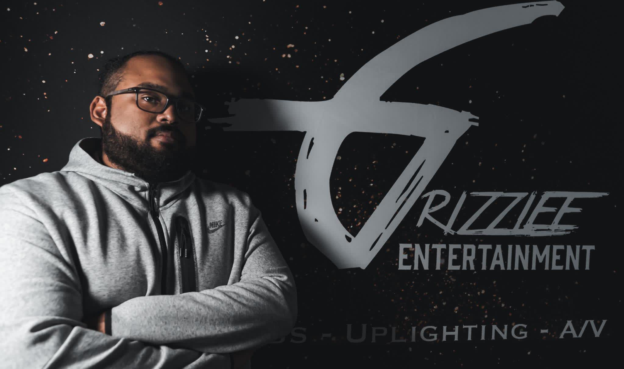 Grizzlee Entertainment founder at the branded booth wall