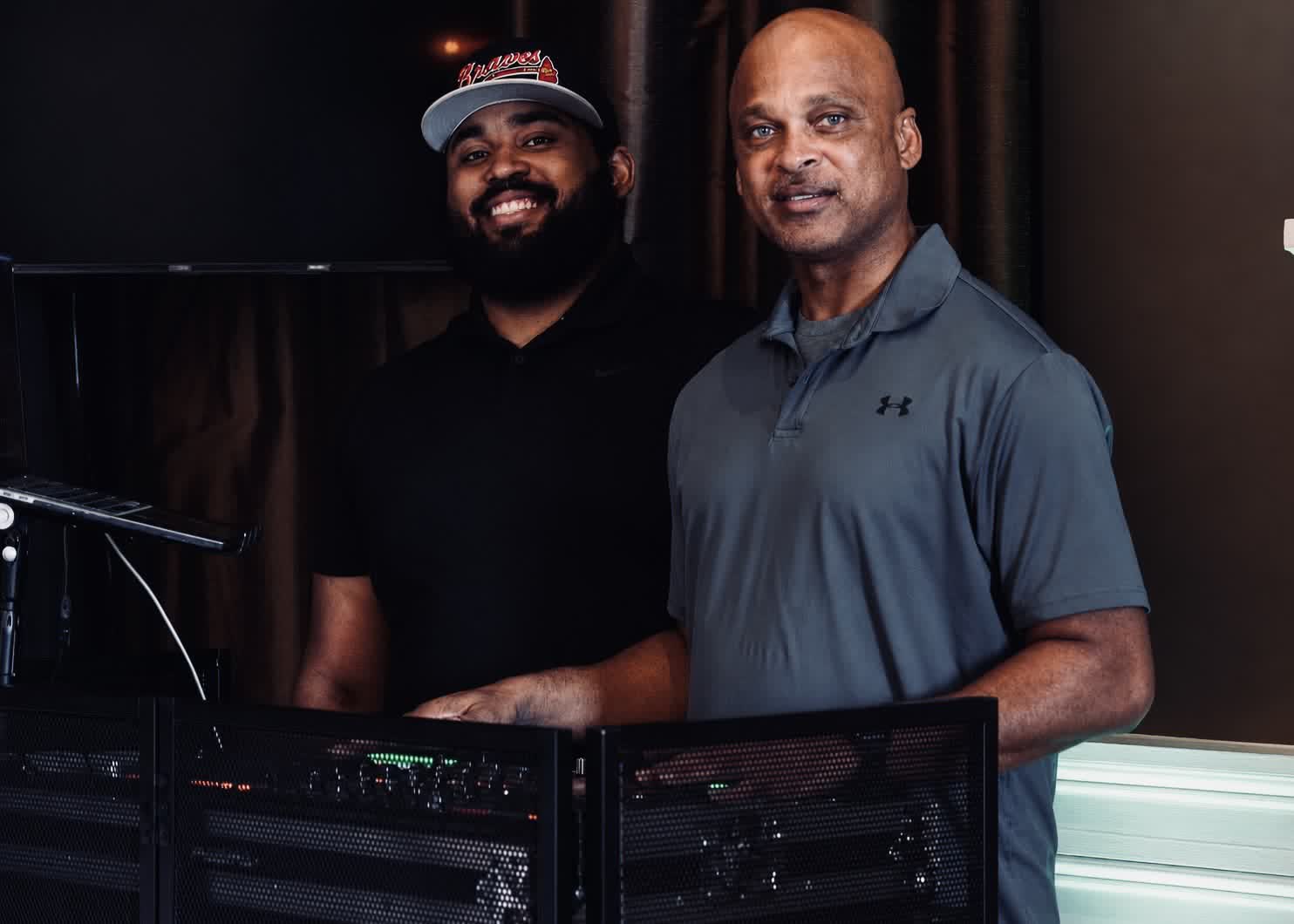 The GrizzLee Entertainment DJ team behind the booth at a reception