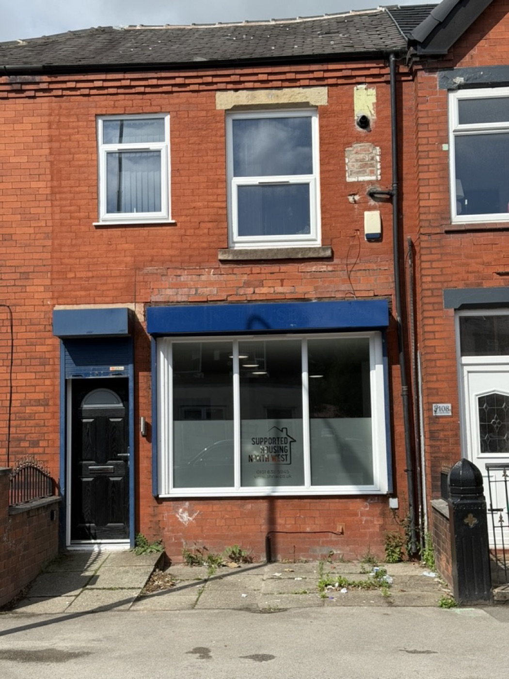 Front of 106 Gidlow Lane after refurbishment, with the ground-floor office frontage