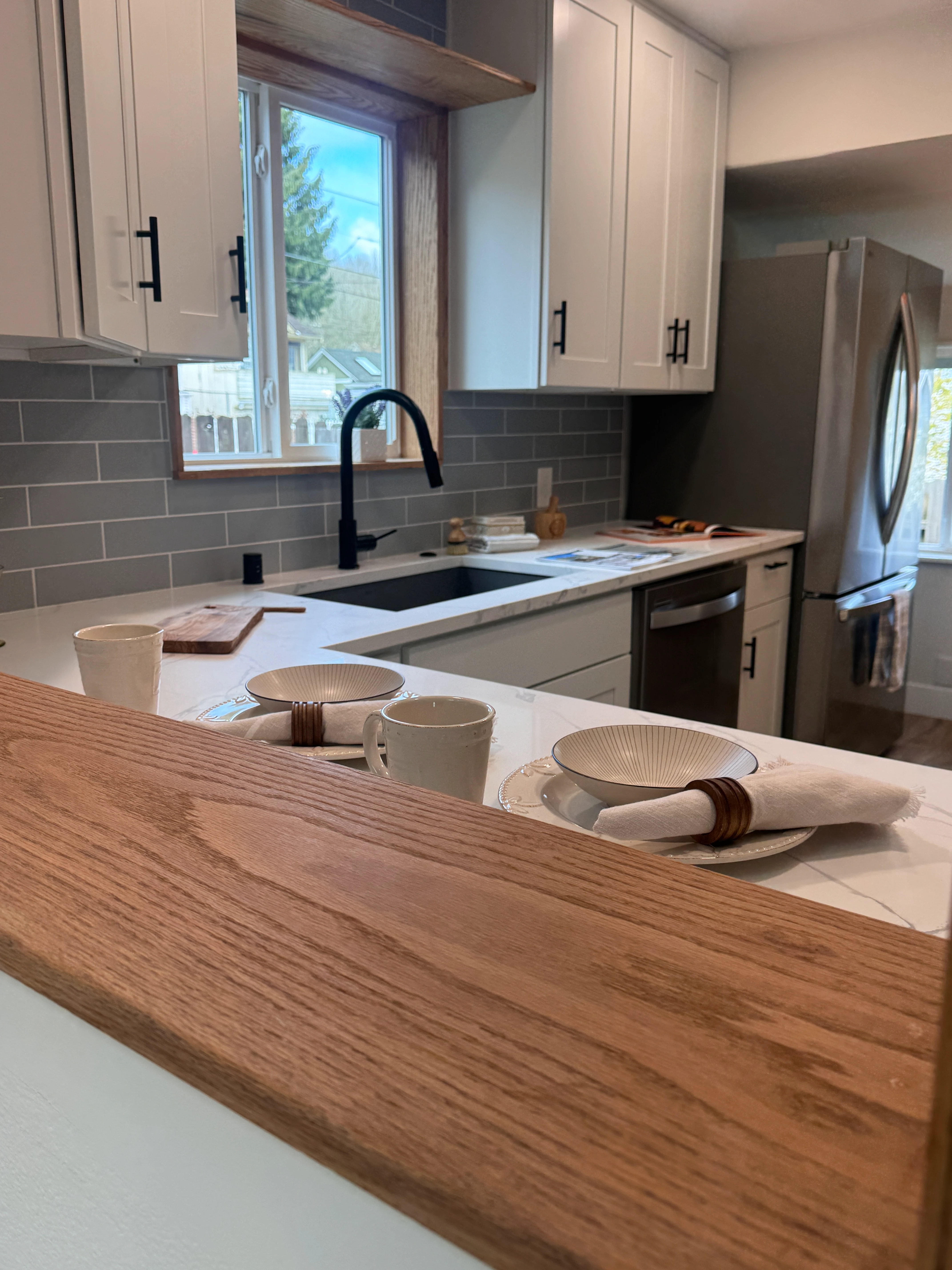 Bright modern kitchen with white cabinets Seattle