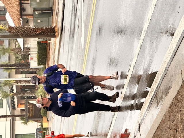 Tucker encouraging Todd during his marathon.