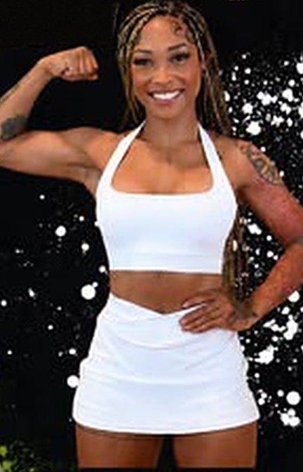 Yinessa Nicole flexing in white athletic wear