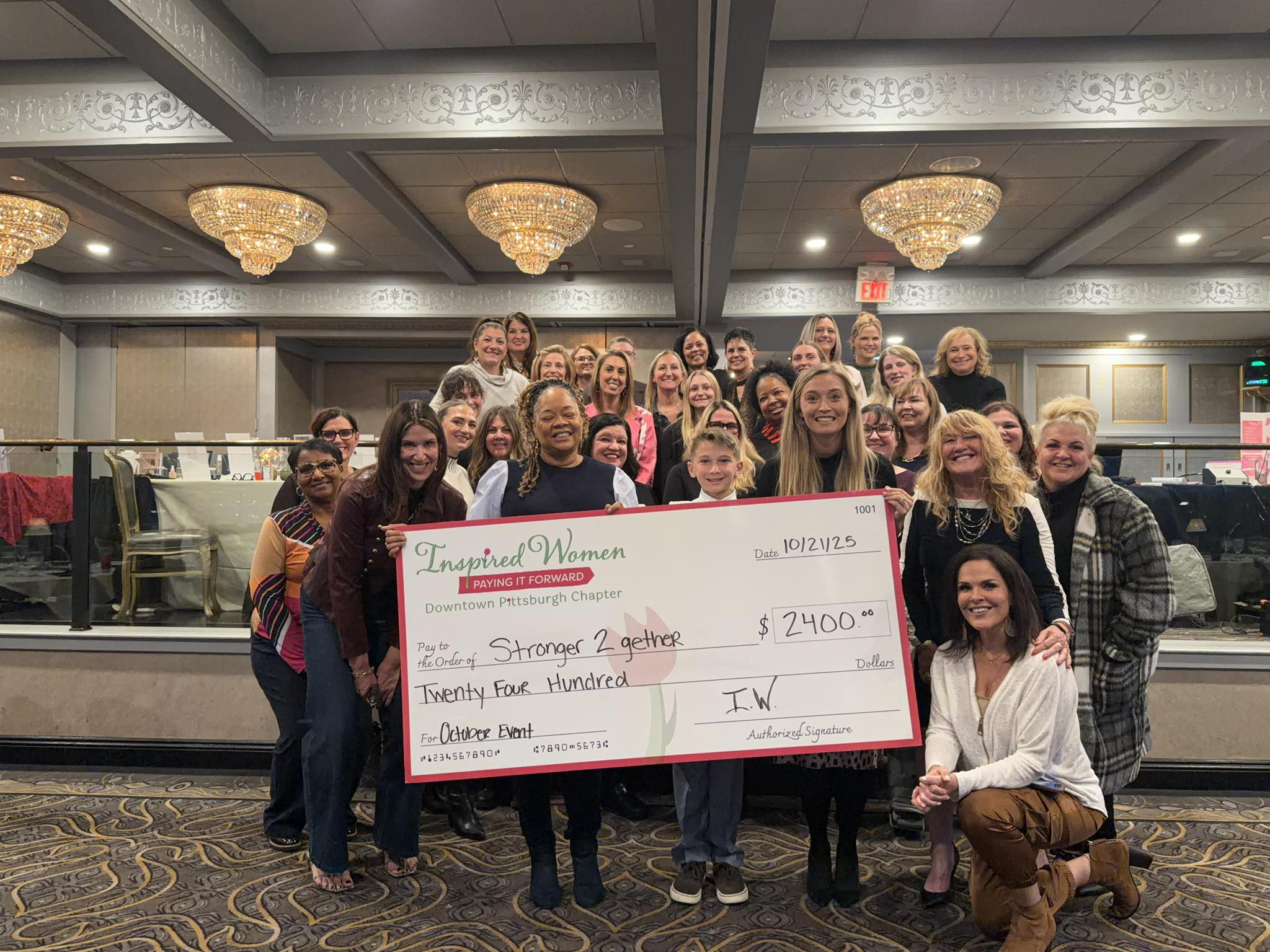 Stronger 2gether receiving the ceremonial check from Inspired Women Downtown Pittsburgh members at Le Mont