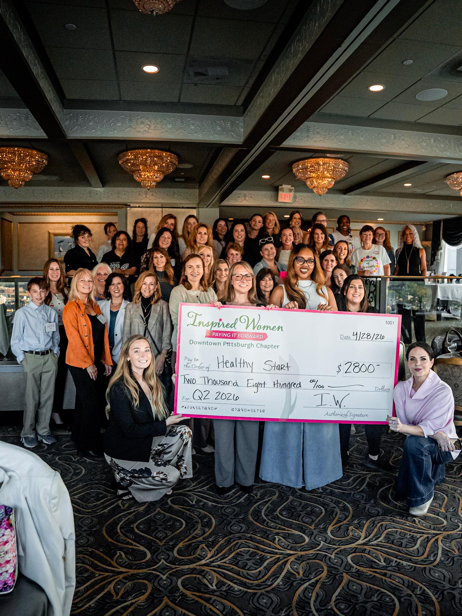 Healthy Start Pittsburgh receiving the ceremonial check from Inspired Women Downtown Pittsburgh members at Le Mont