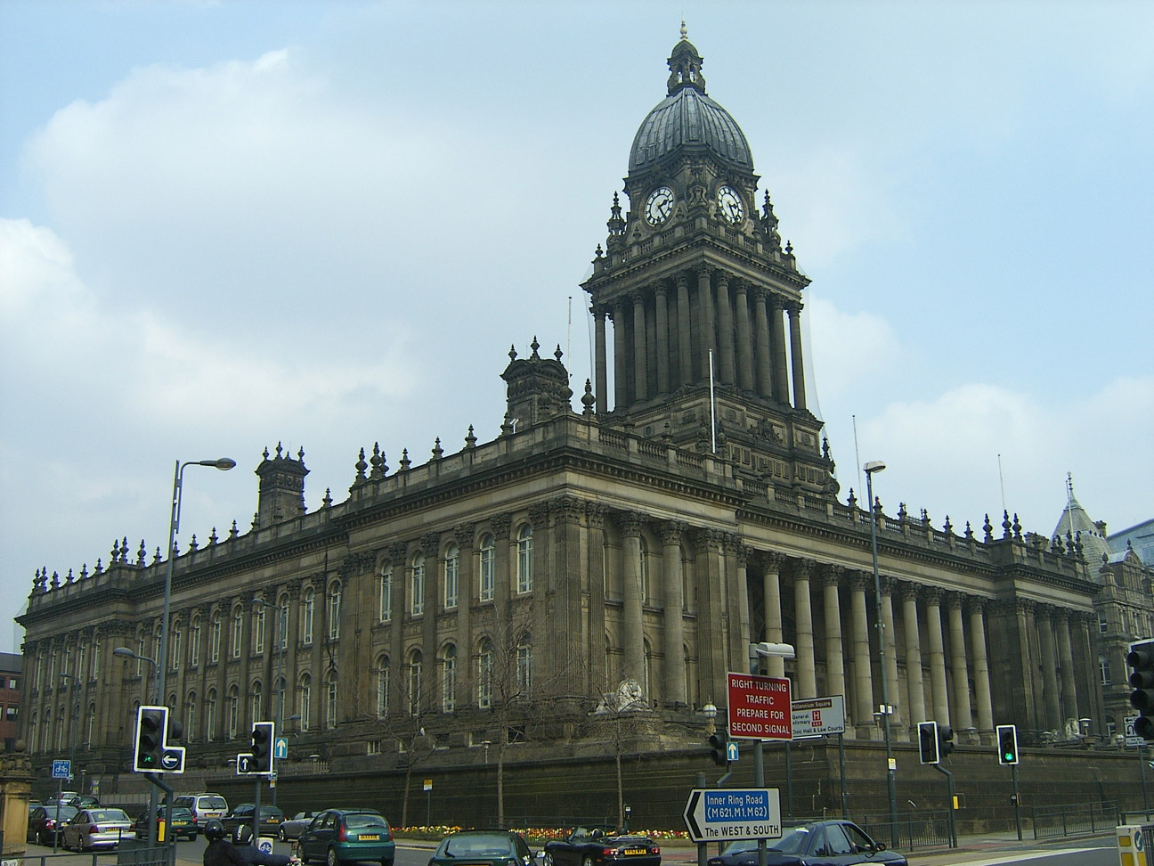 Historic photograph of Leeds Town Hall, showing its Victorian stone façade and clock tower