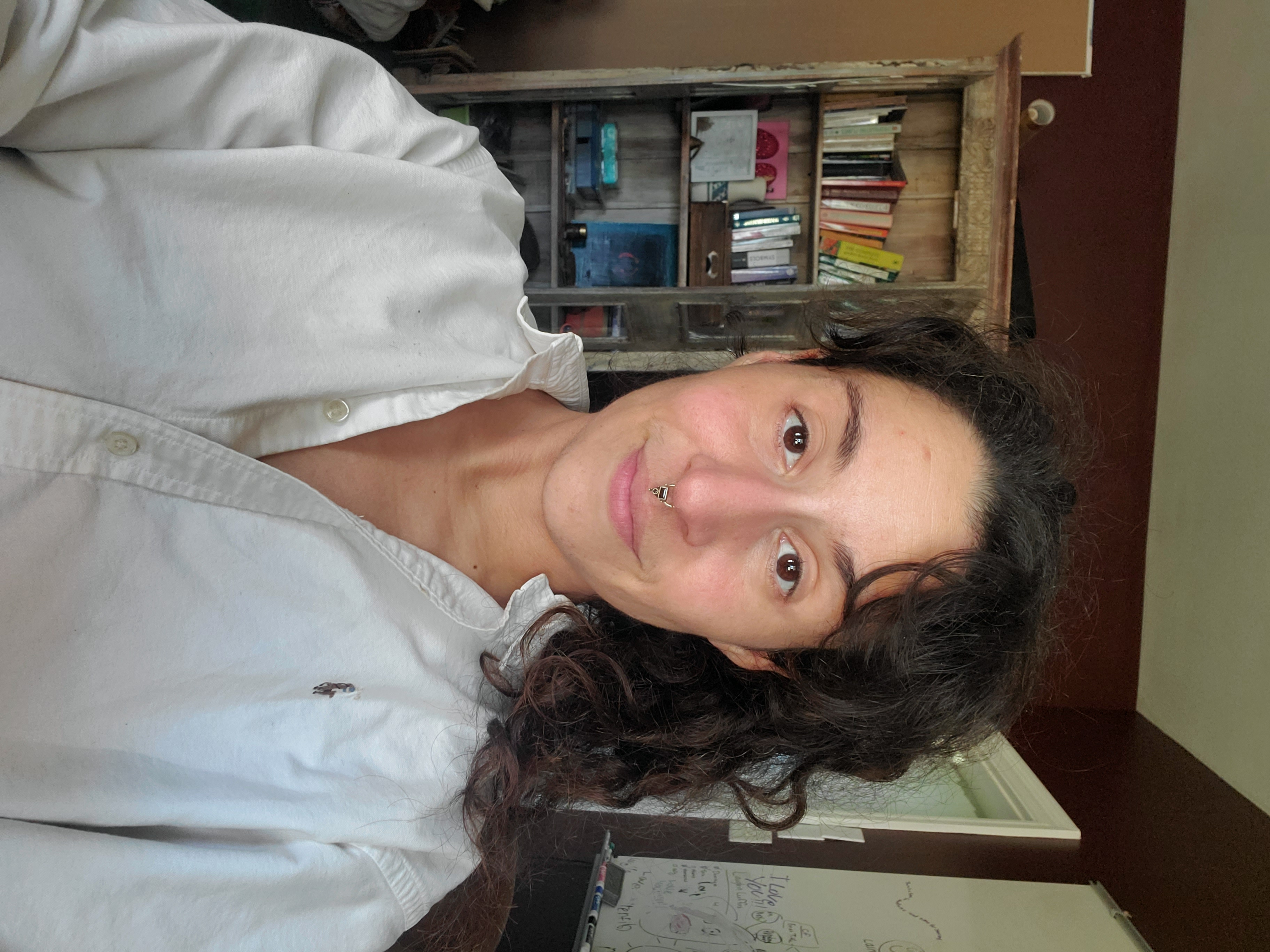 Melodie in a white shirt in February 2025, after she reported her skin had cleared