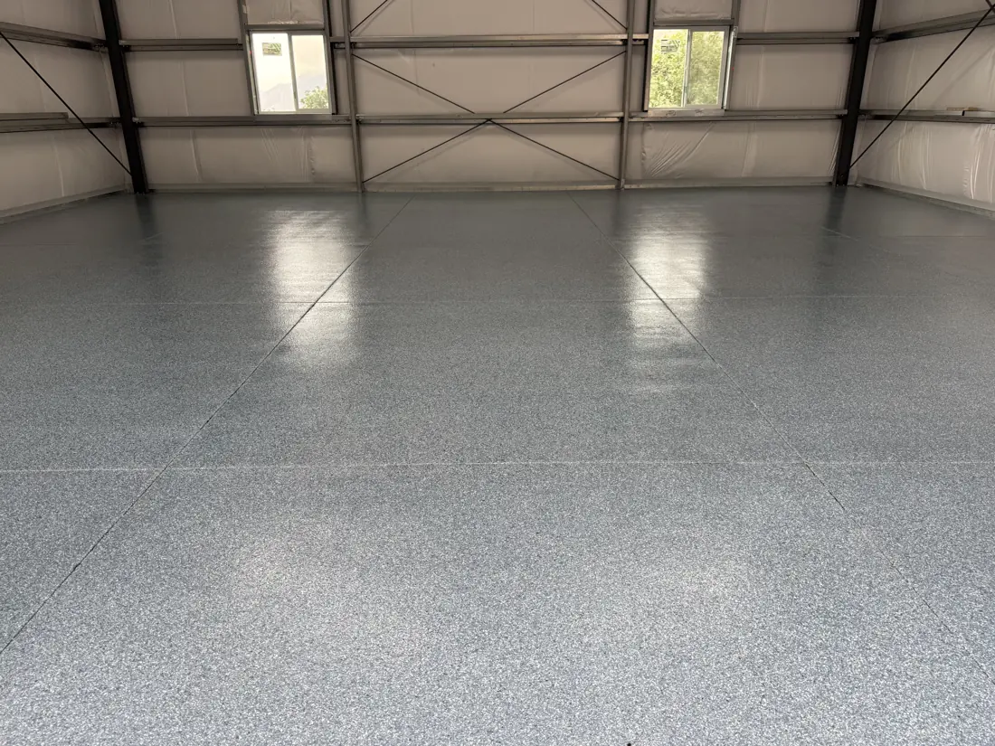 Shop after: glossy gray flake floor across the whole building