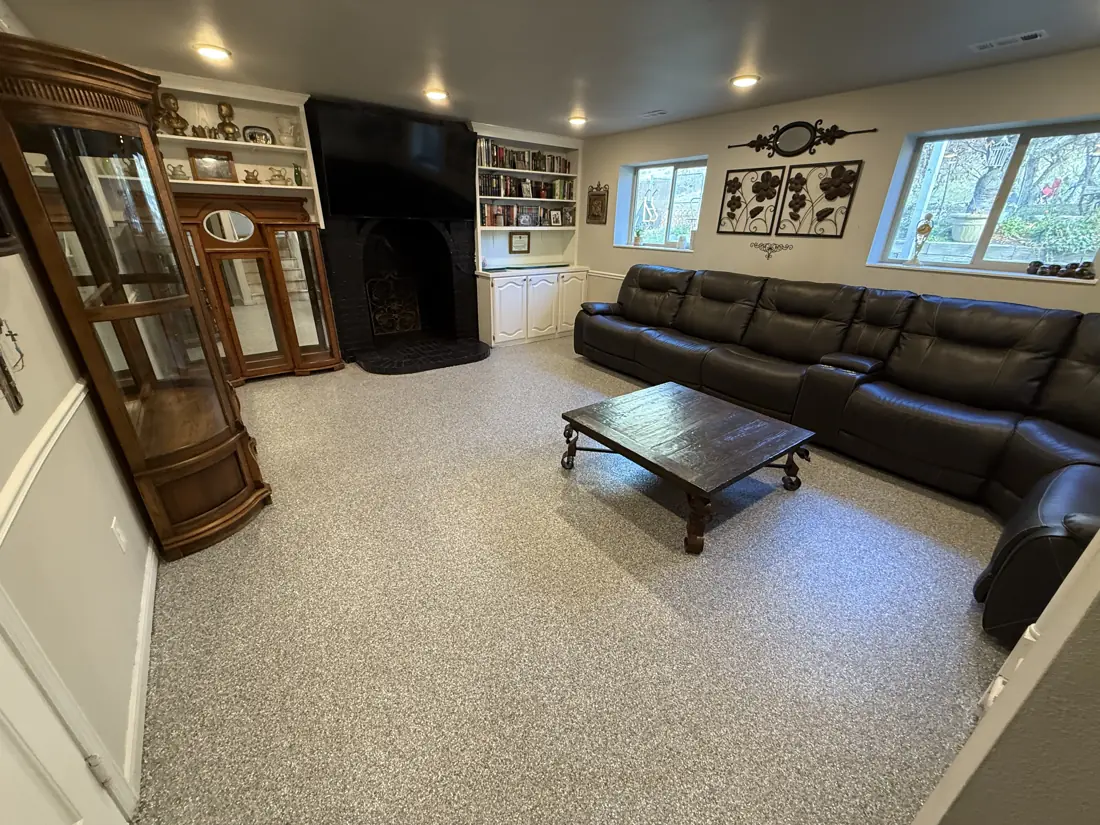 Basement after: light flake floor in a finished family room