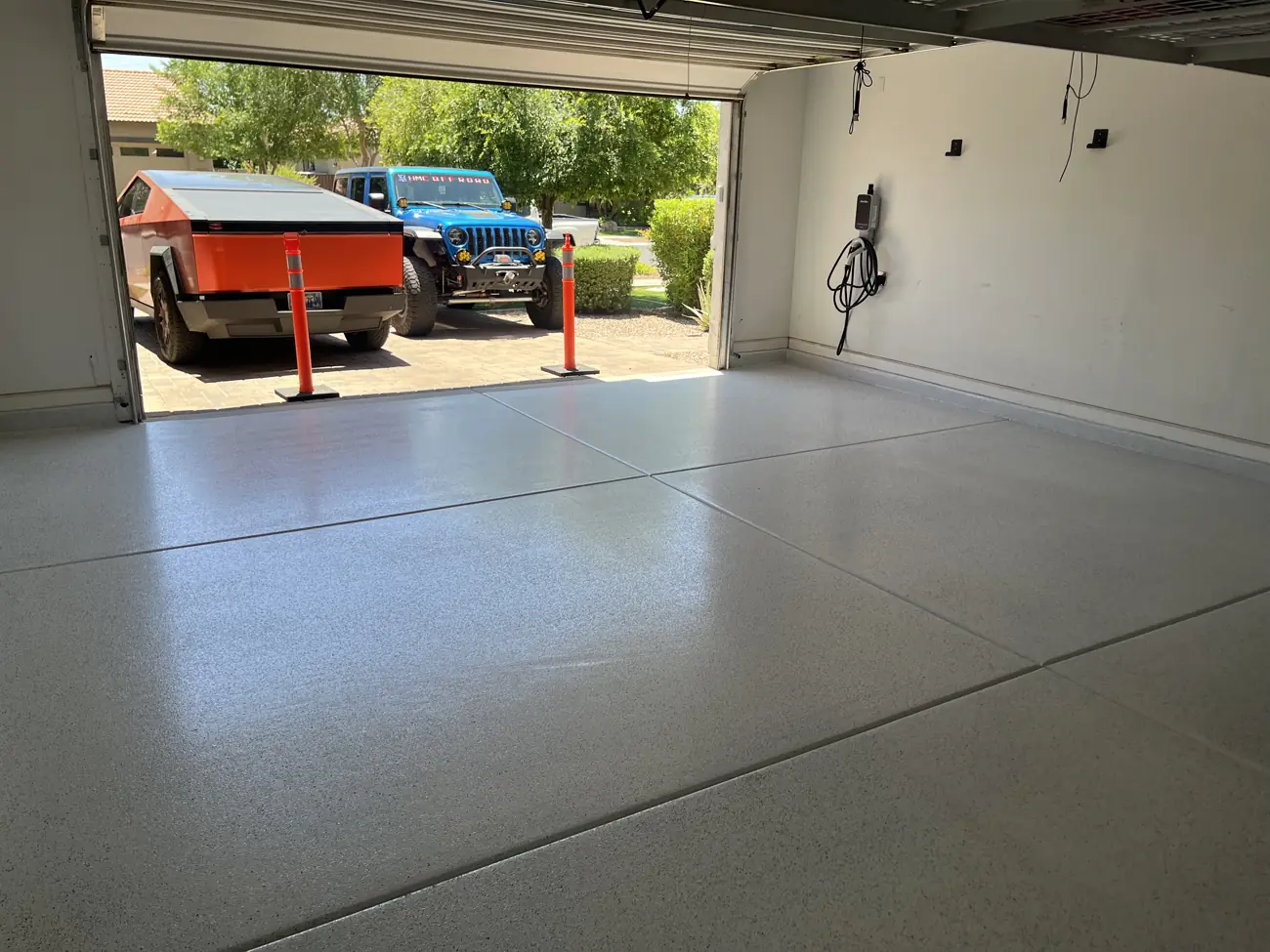 Bright garage with a light flake floor and a clean joint line