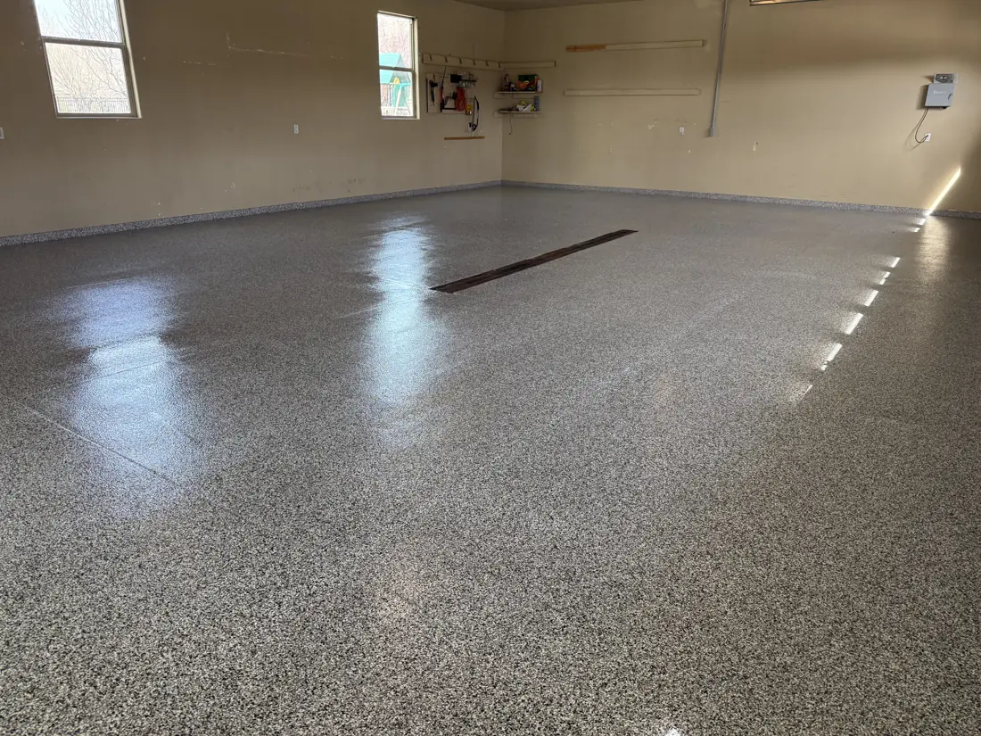 Garage after: glossy flake floor with trench drain