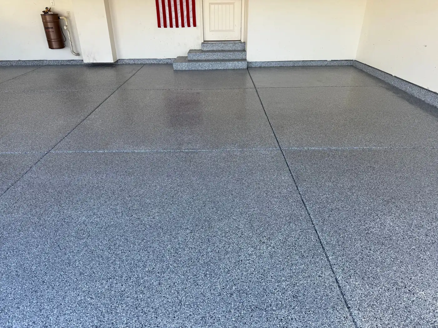 Garage after: gray flake coating with a glossy clear topcoat, steps coated too