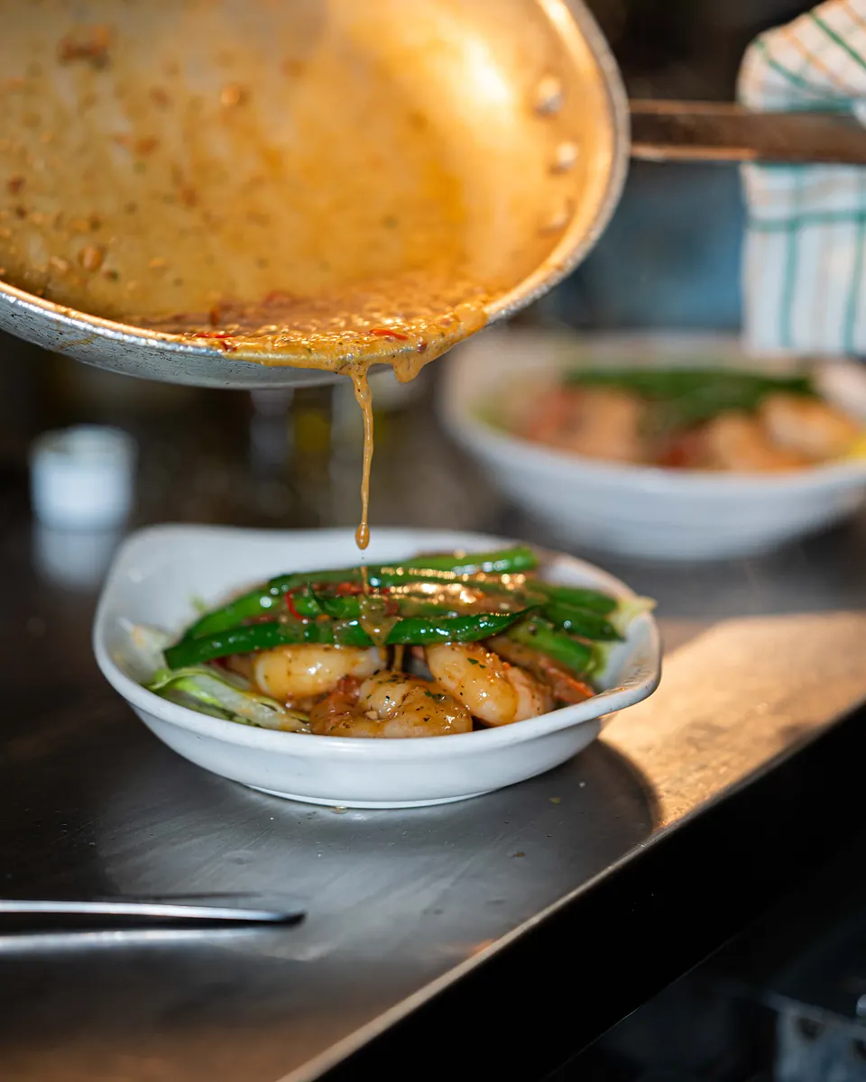 Gamberi: prawns pan-roasted in olive oil, flamed with brandy and served with green beans
