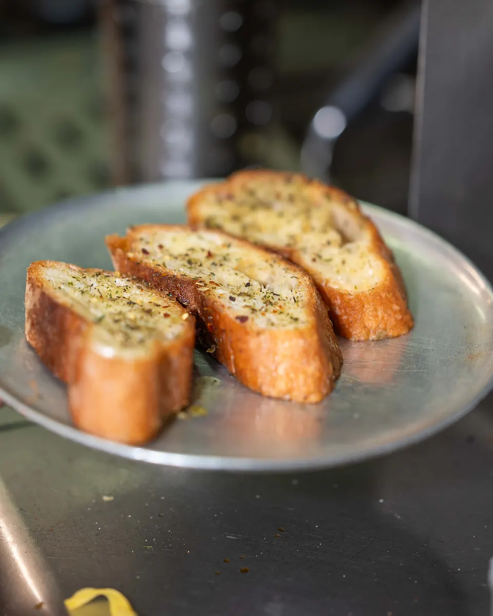 Oven-baked ciabatta with garlic, fresh from the kitchen
