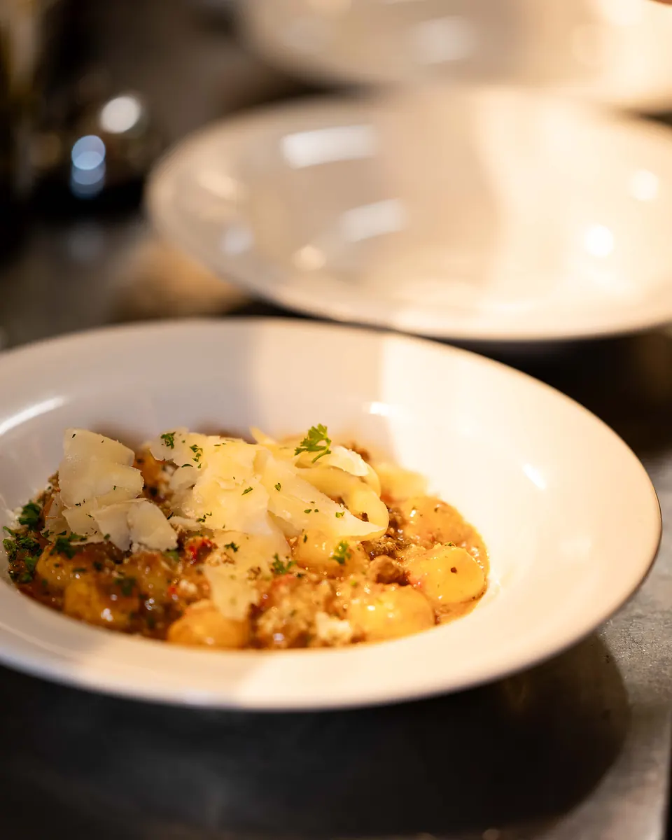 Gnocchi with bolognese sauce and shaved parmigiano