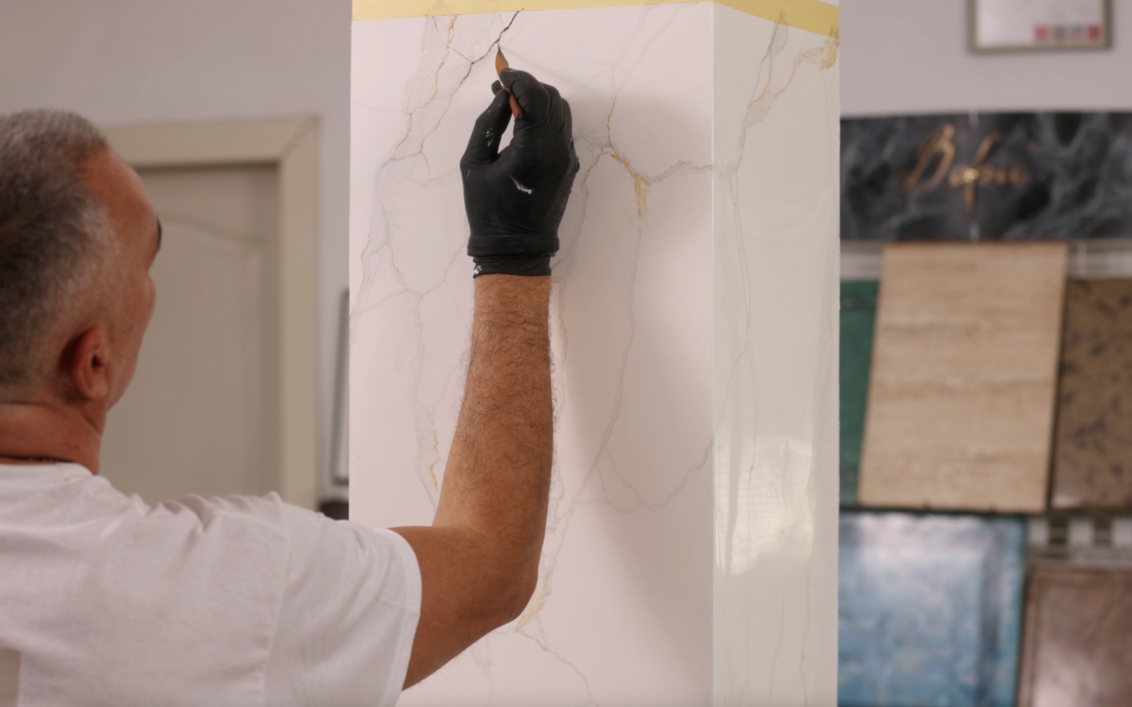 A hand-applied Carrara marble effect wall with fine grey veining