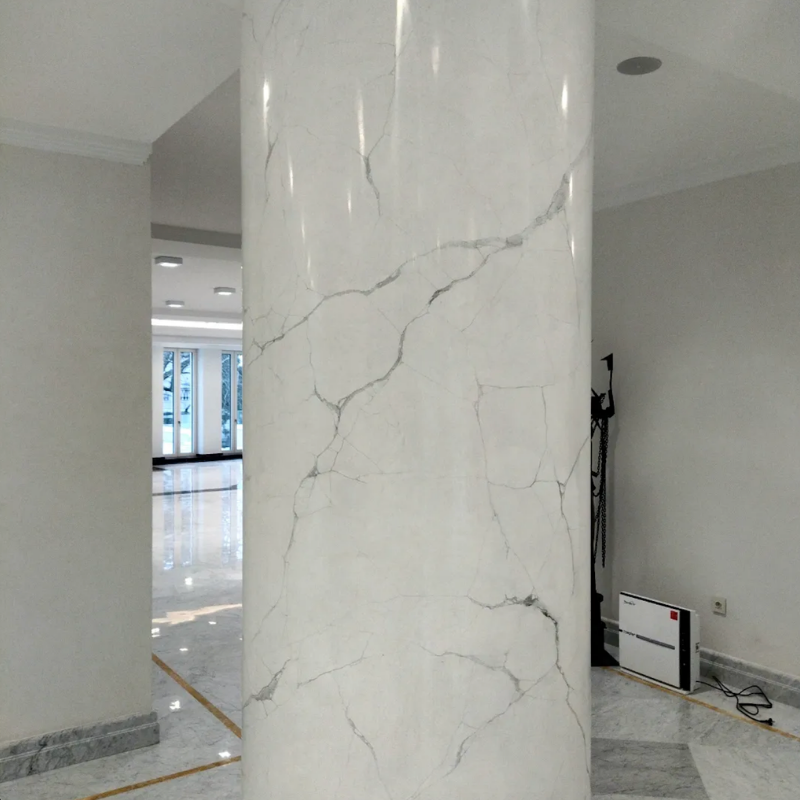 Carrara marble effect with fine soft grey veining on a white ground