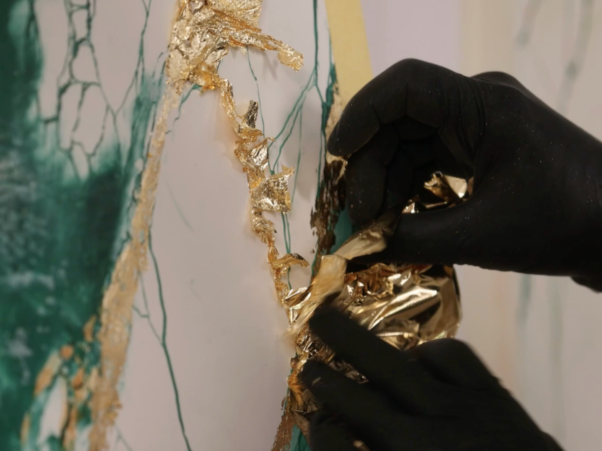 Gold leaf detail applied to a marble effect plaster finish