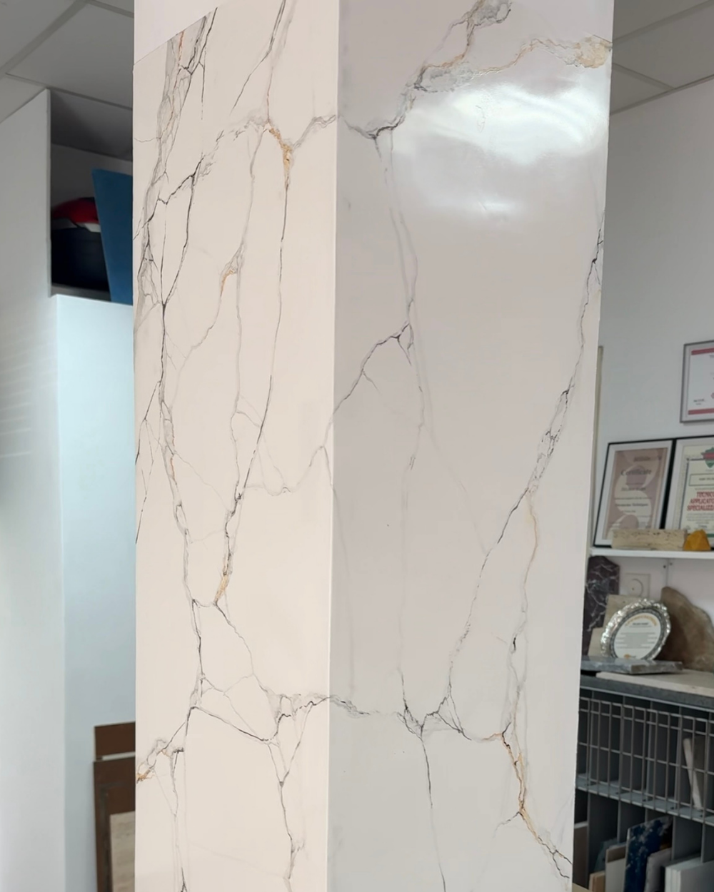 A pillar finished in hand-applied marble effect plaster
