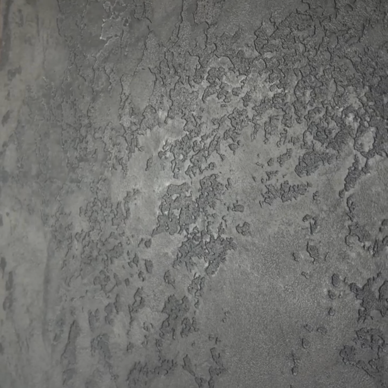 Heavily textured rock-effect plaster finish with visible relief