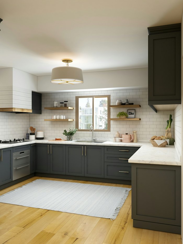 Kitchen cabinetry with a stone countertop