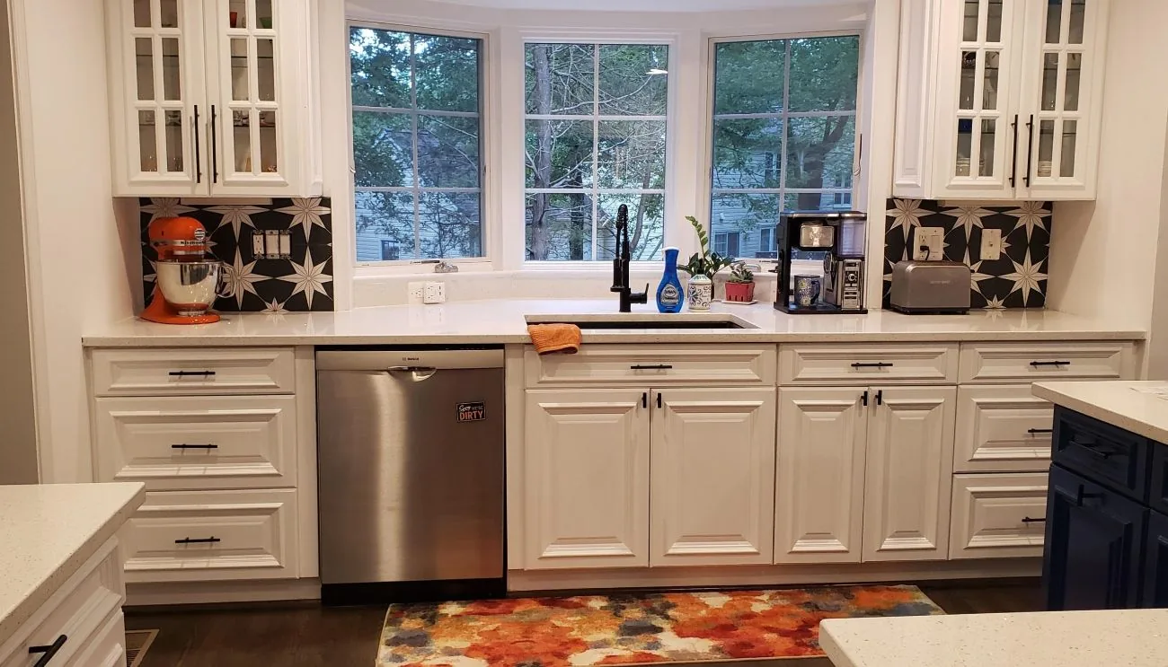 Kitchen cabinetry with a stone countertop